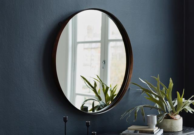 Oriel large round mirror and house plant.