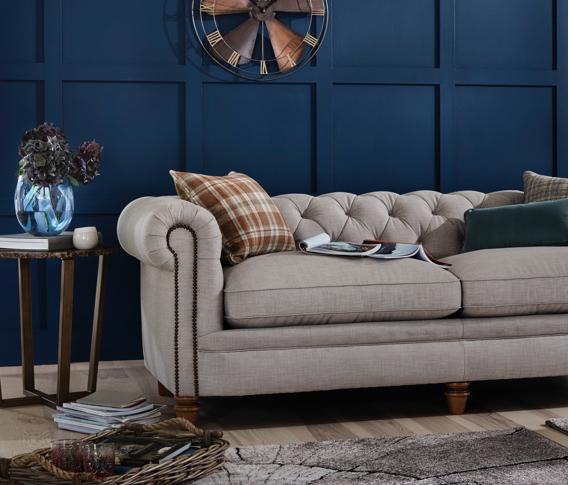 Grey fabric Chesterfield style sofa