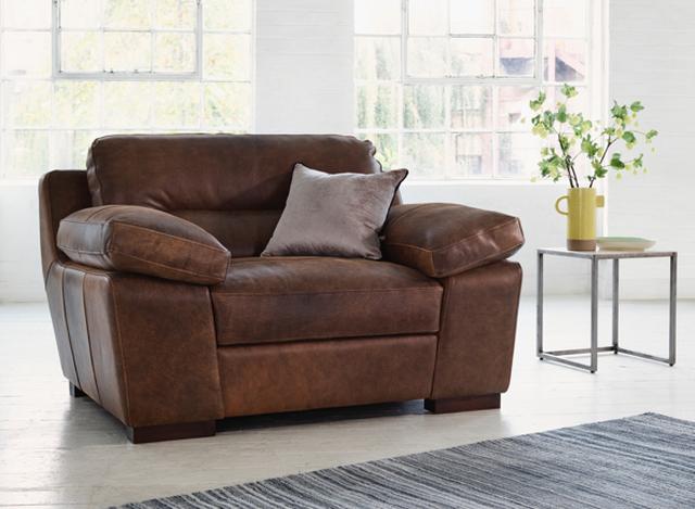 Distressed brown leather brown cuddle chair