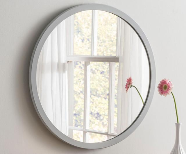 White dining room ideas: round white framed mirror