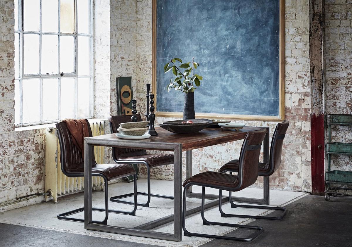 Wooden dining table with upholstered chairs