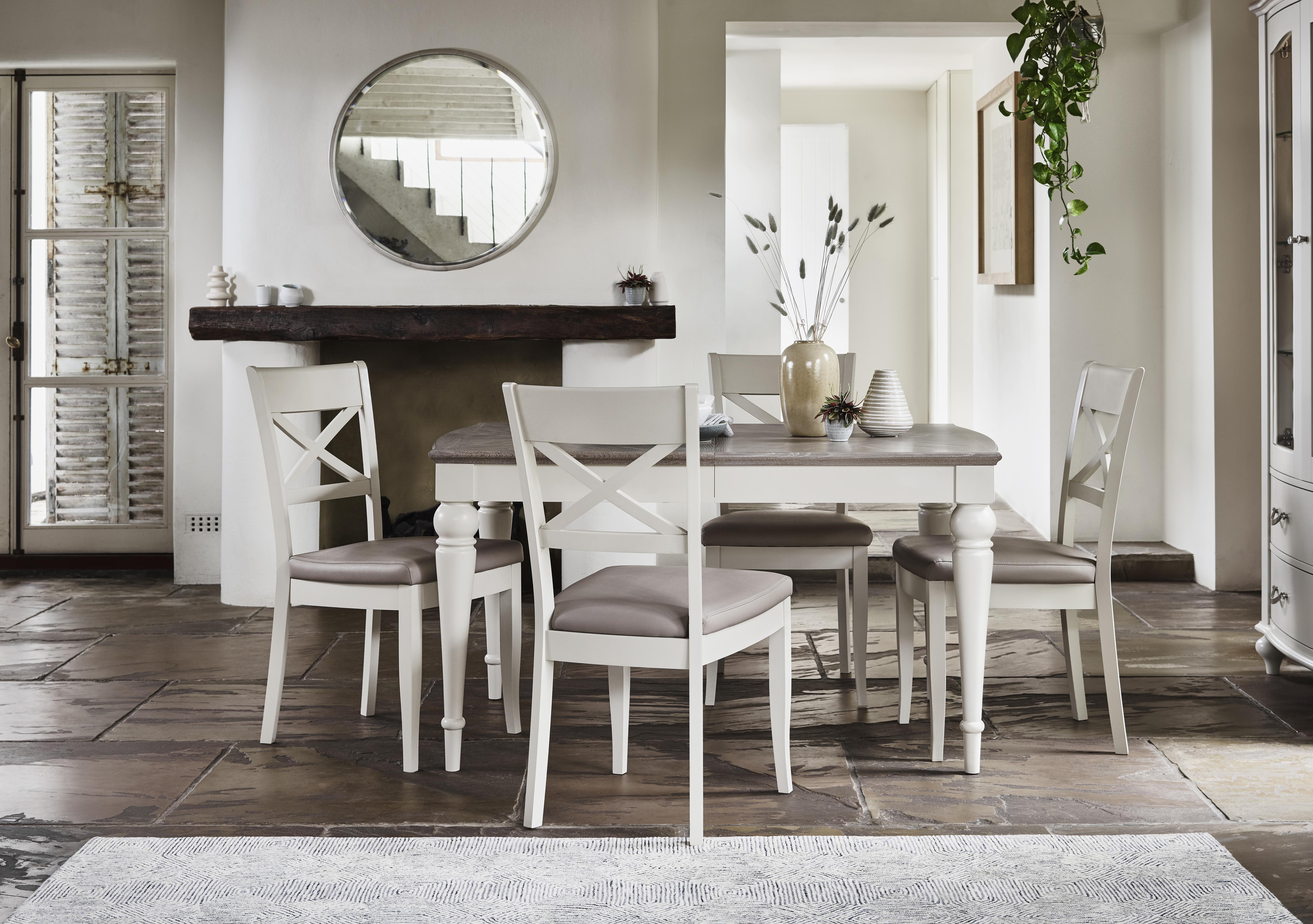 Annecy Extending Dining Table with 4 Faux Leather Cross Back Chairs in  on Furniture Village