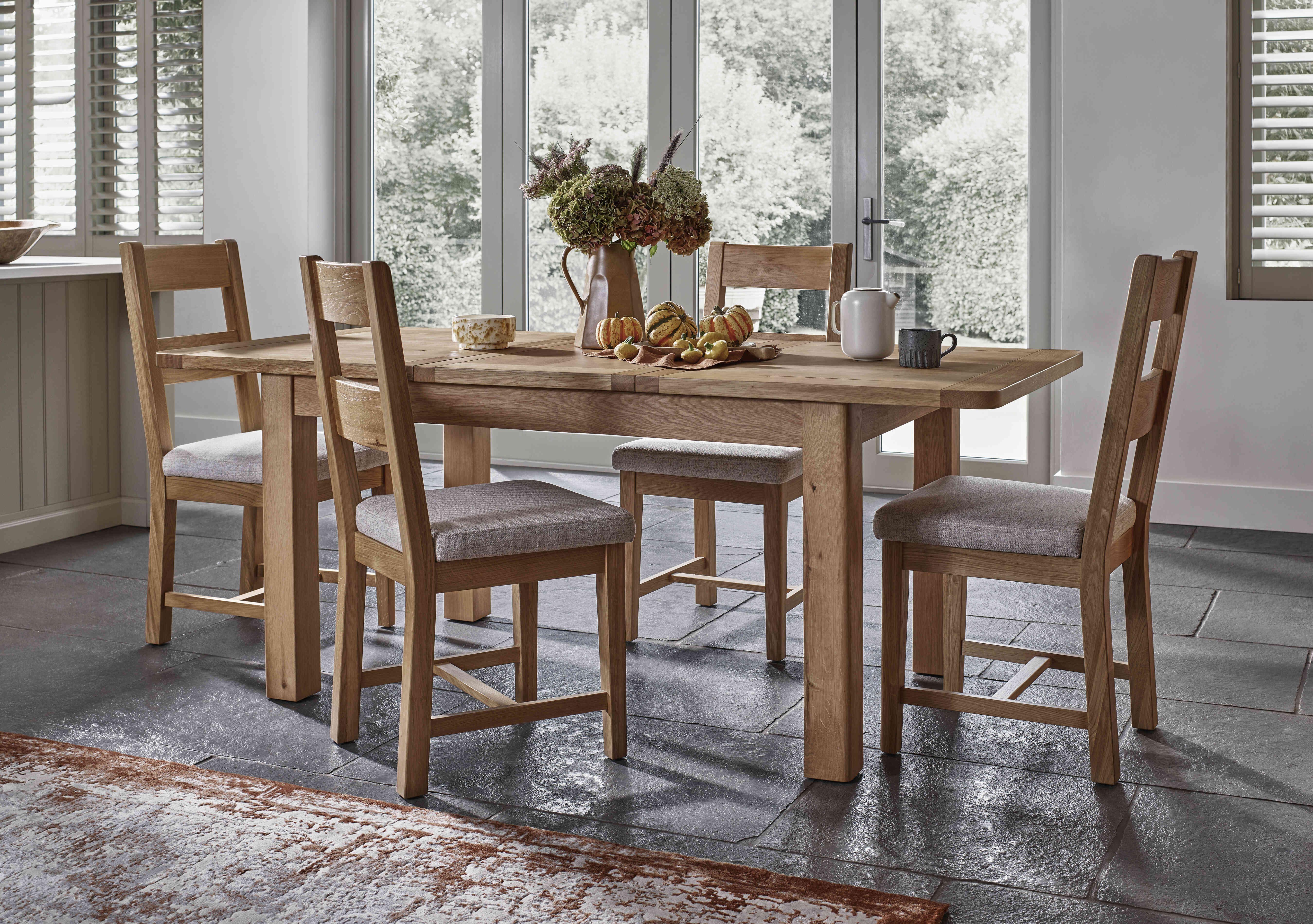 Augusta Small Rectangular Extending Dining Table and 4 Wooden Ladderback Dining Chairs in  on Furniture Village