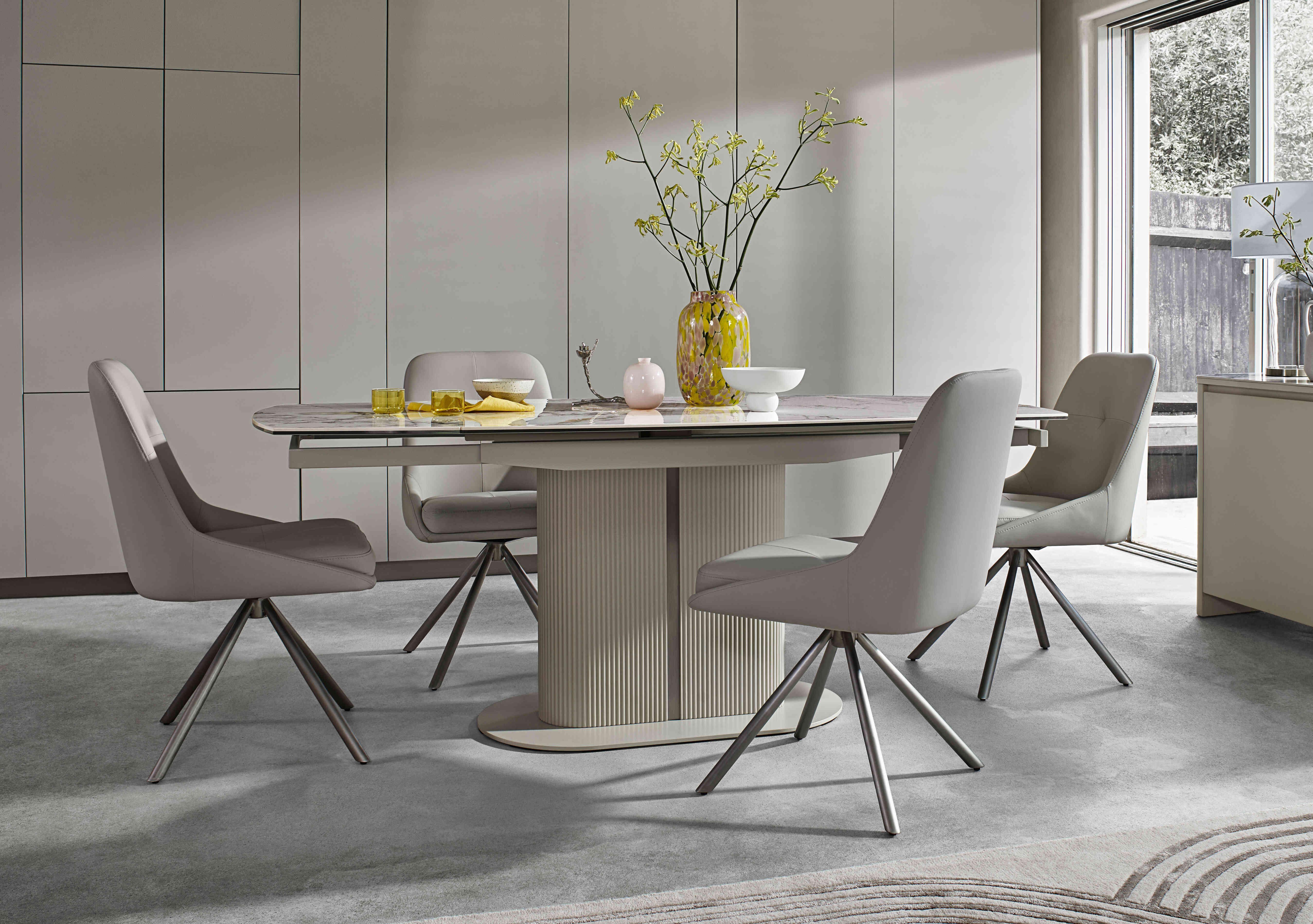 Avorio Swivel Extending Dining Table and 4 Swivel Dining Chairs Set in  on Furniture Village