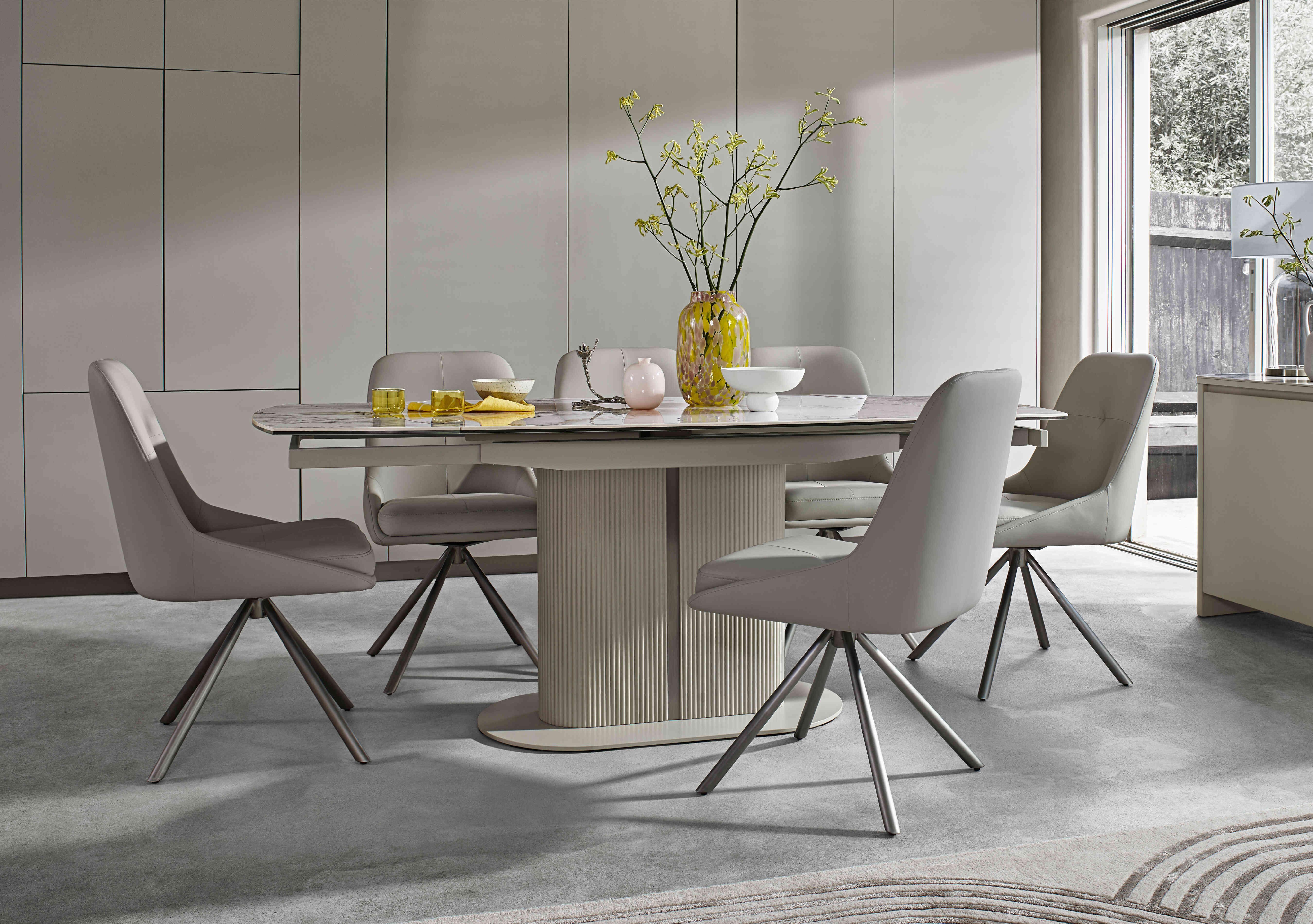 Avorio Swivel Extending Dining Table and 6 Swivel Dining Chairs Set in  on Furniture Village