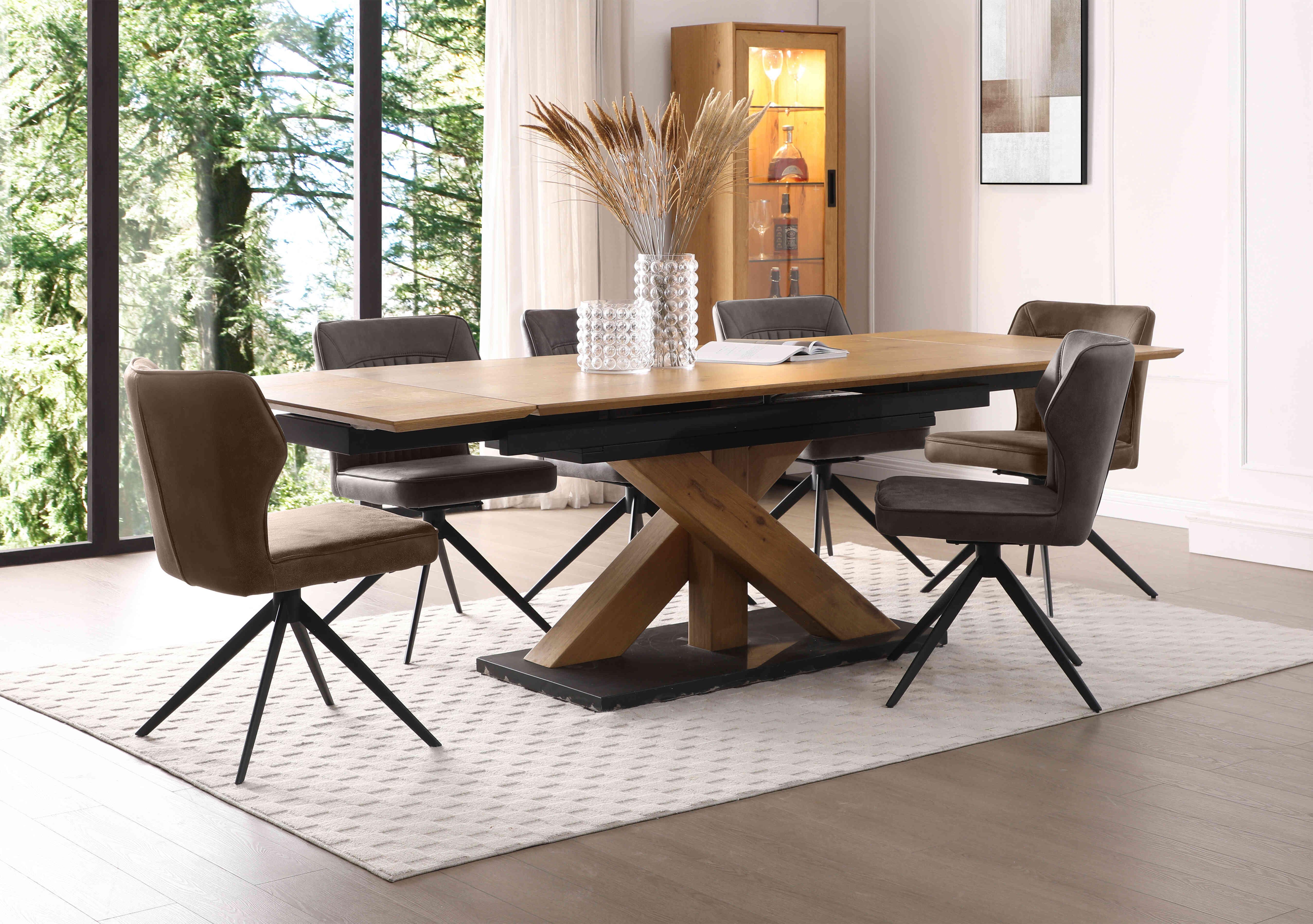 Aydin Large Extending Dining Table with 4 Dark Grey Swivel Dining Chairs and 2 Light Brown Swivel Dining Chairs in  on Furniture Village