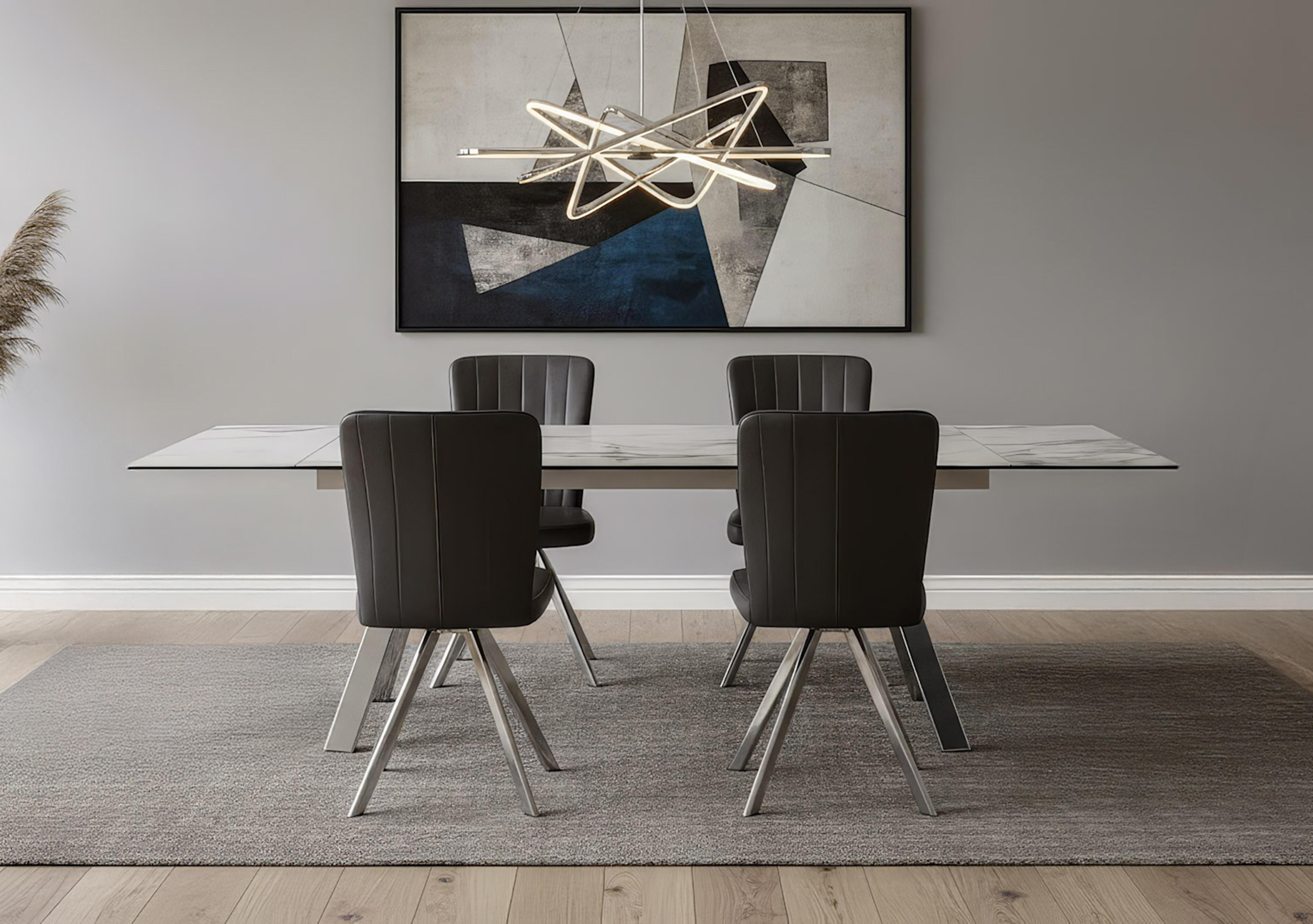 Blink Extending Dining Table and 4 Faux Leather Swivel Dining Chairs in  on Furniture Village