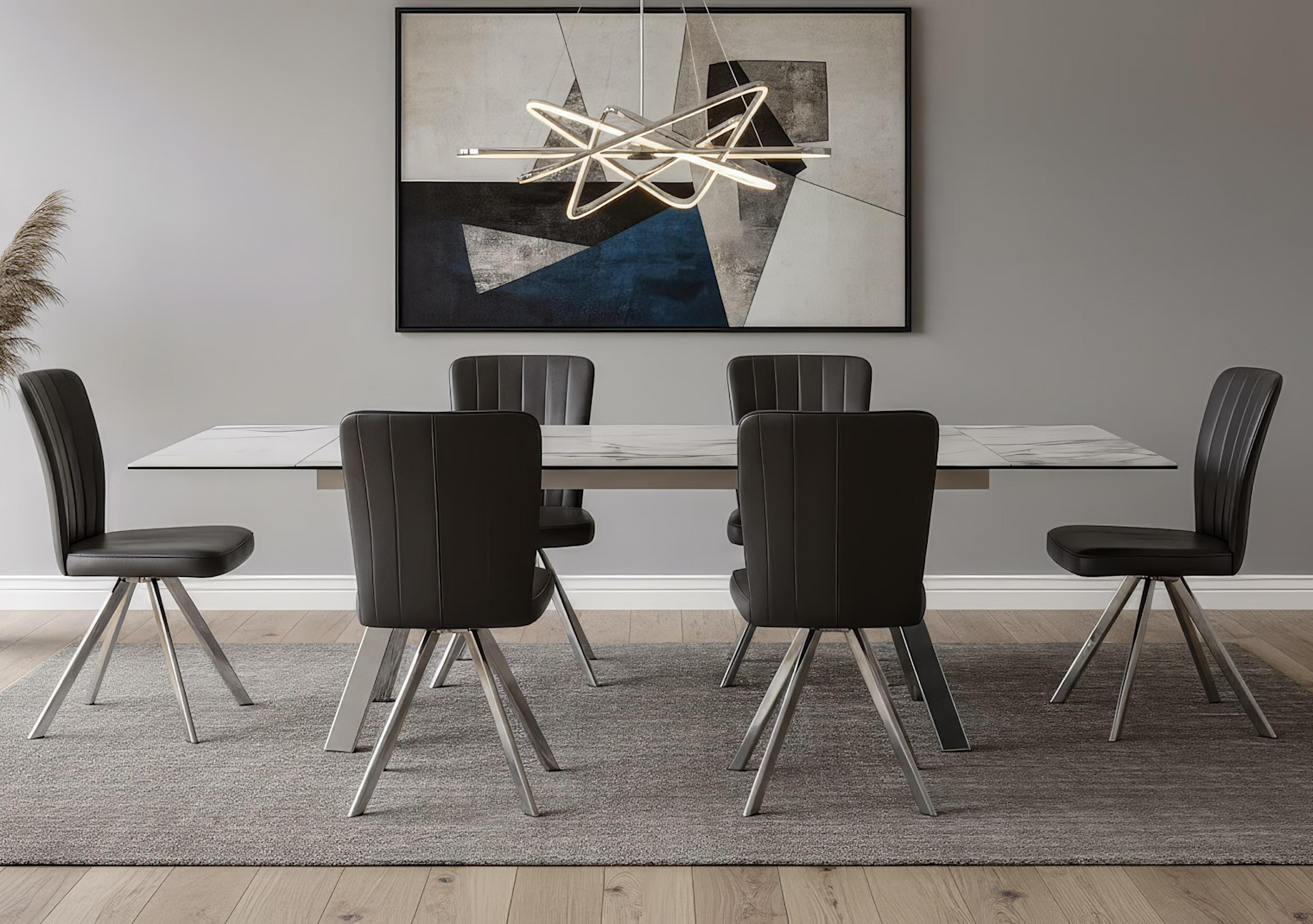 Blink Extending Dining Table and 6 Faux Leather Swivel Dining Chairs in  on Furniture Village