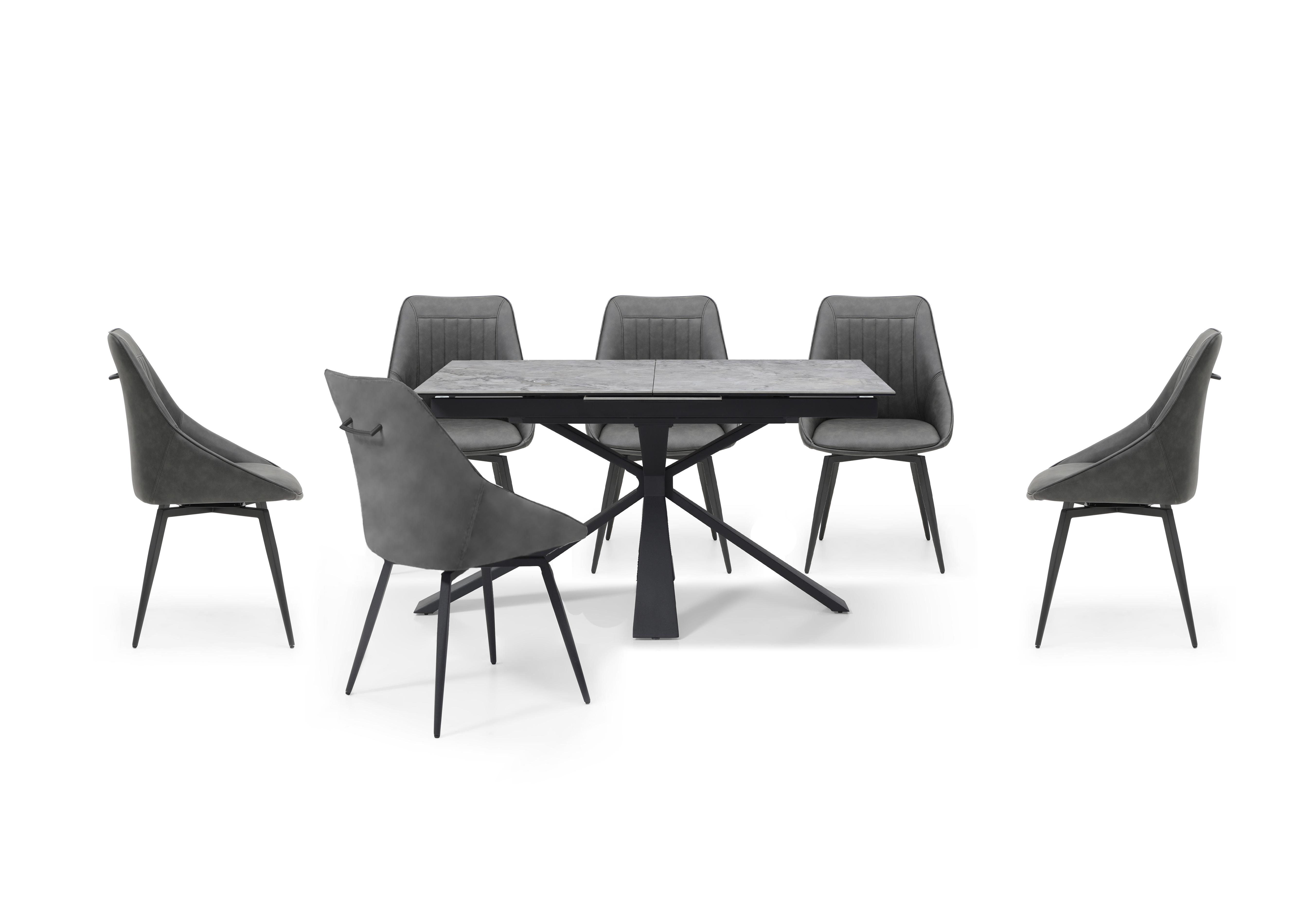 Crete Small Extending Dining Table and 6 Faux Leather Swivel Dining Chairs in  on Furniture Village