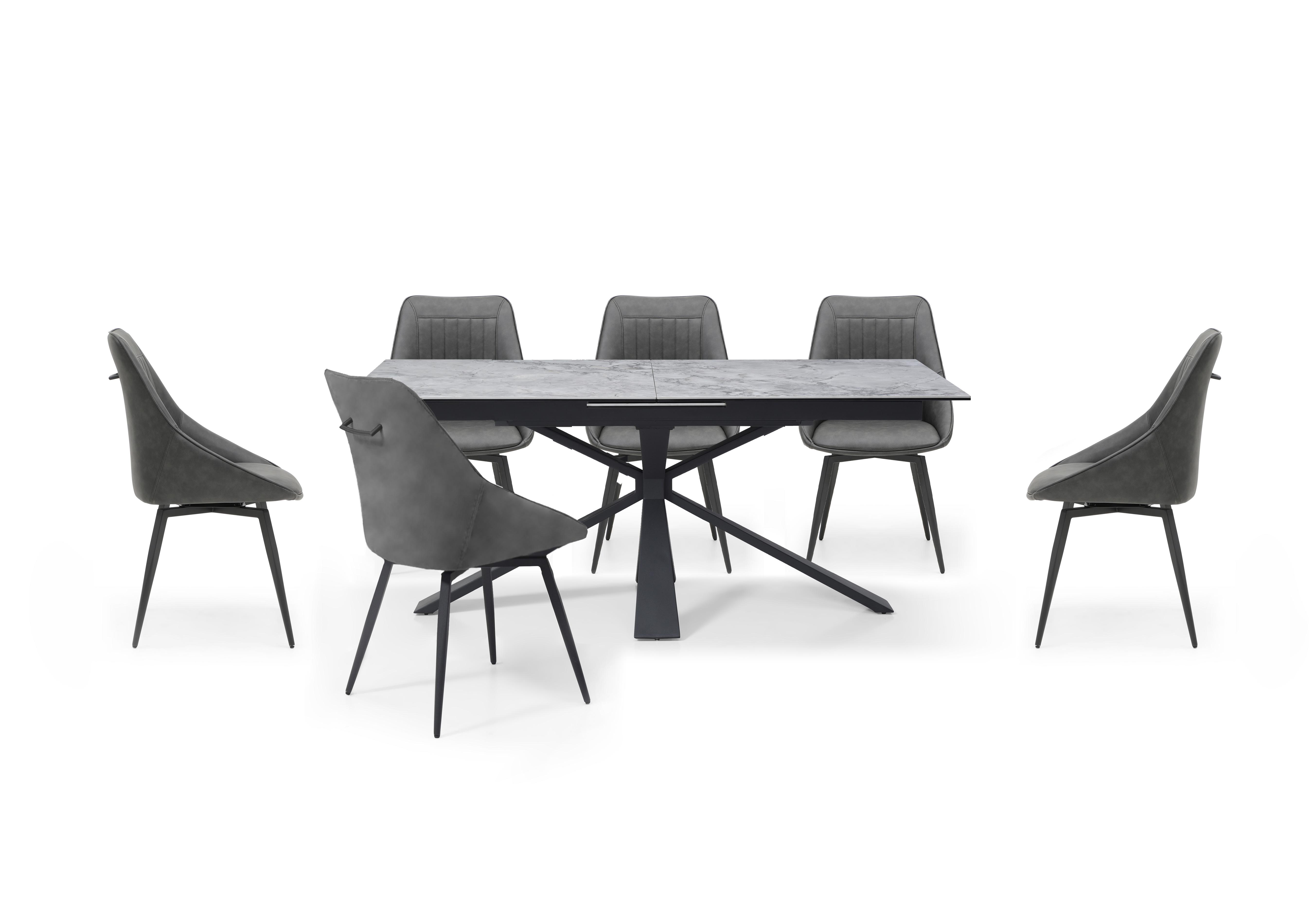 Crete Large Extending Dining Table and 6 Faux Leather Swivel Dining Chairs in  on Furniture Village