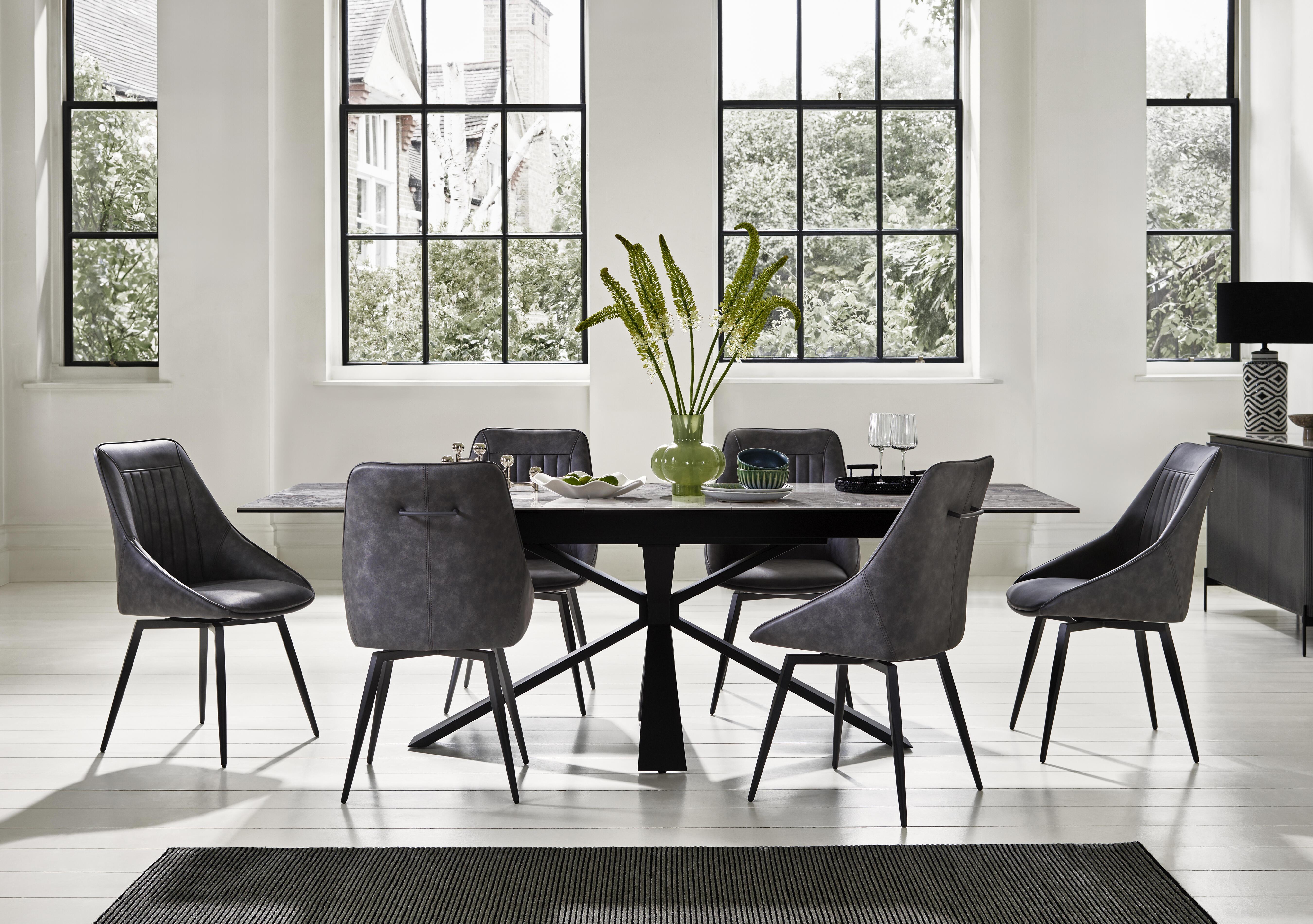 Crete Large Extending Dining Table and 6 Faux Leather Swivel Dining Chairs in  on Furniture Village