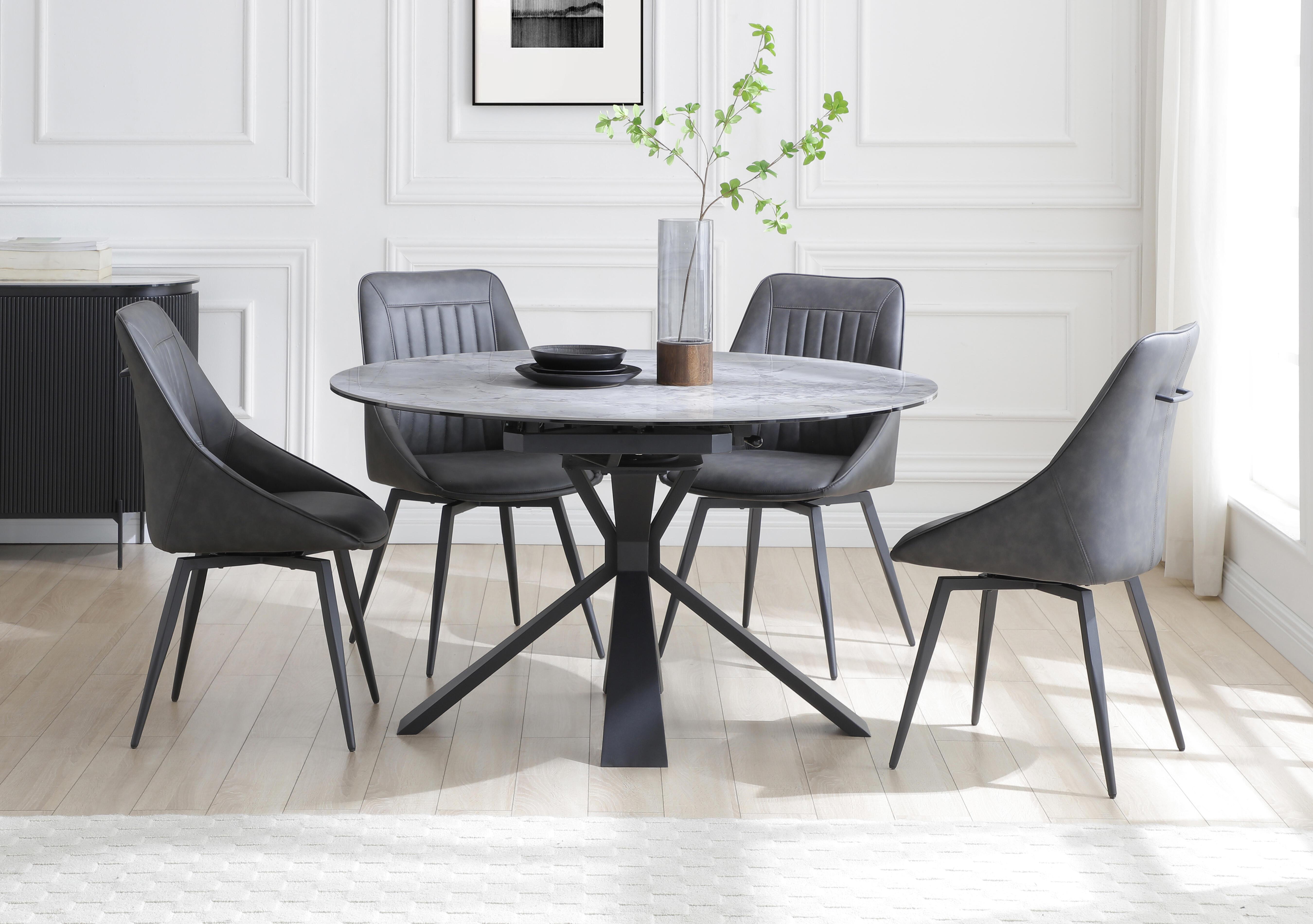 Crete Round Swivel Extending Dining Table and 4 Faux Leather Swivel Dining Chairs in  on Furniture Village