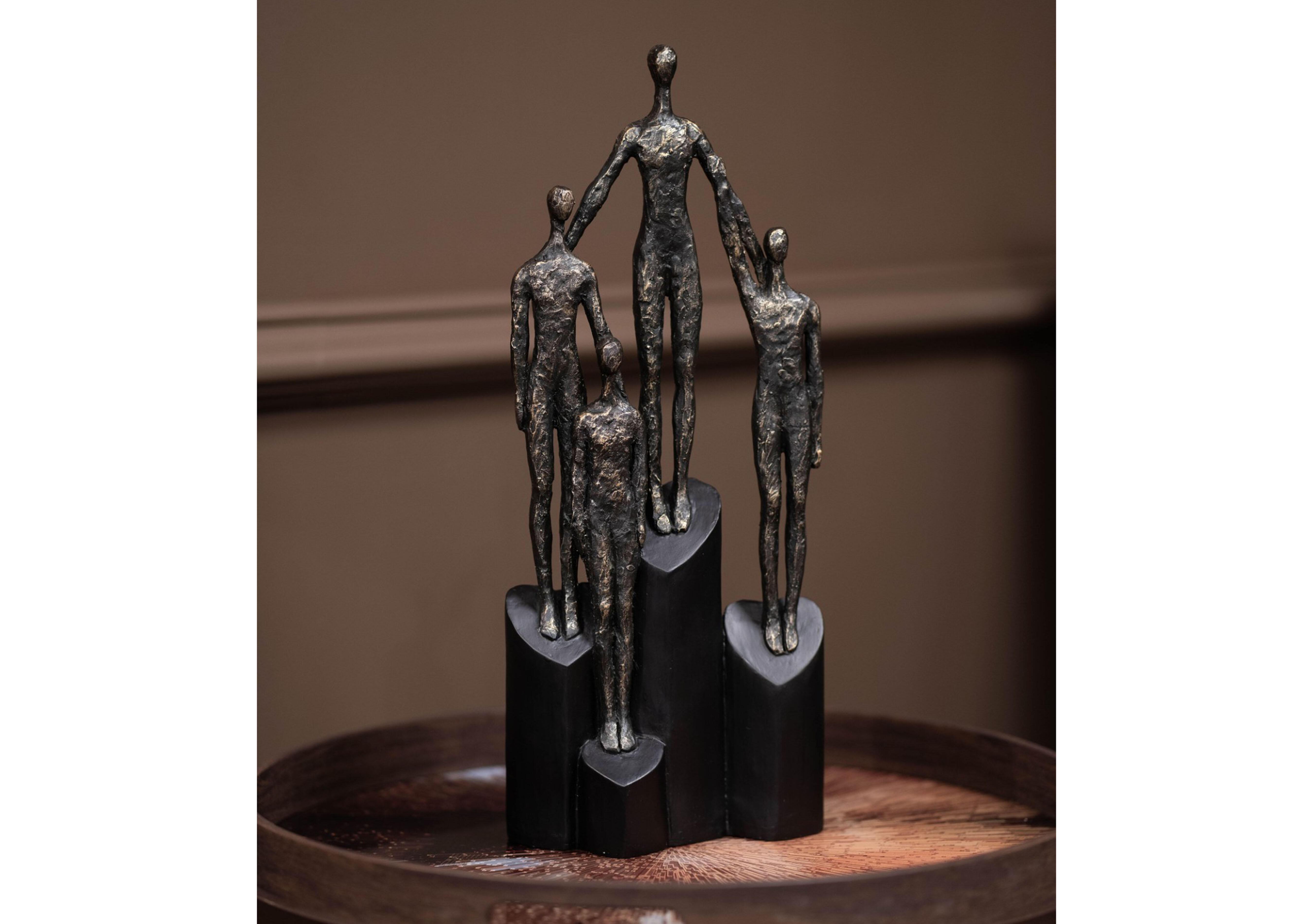Family Sculpture on Hearts Plinth in  on Furniture Village