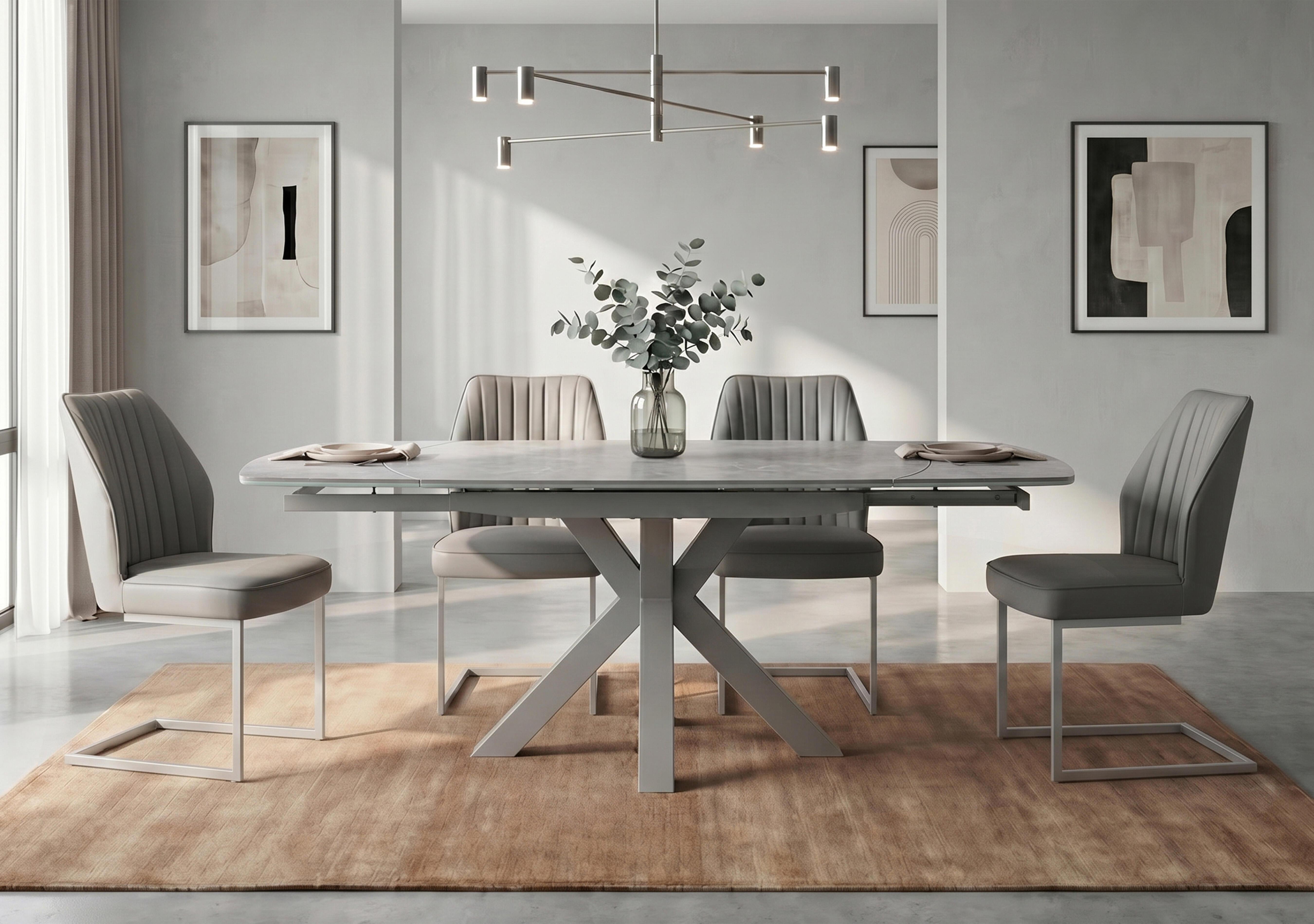 Fumo Swivel Extending Dining Table and 4 Faux Leather Cantilever Dining Chairs in  on Furniture Village