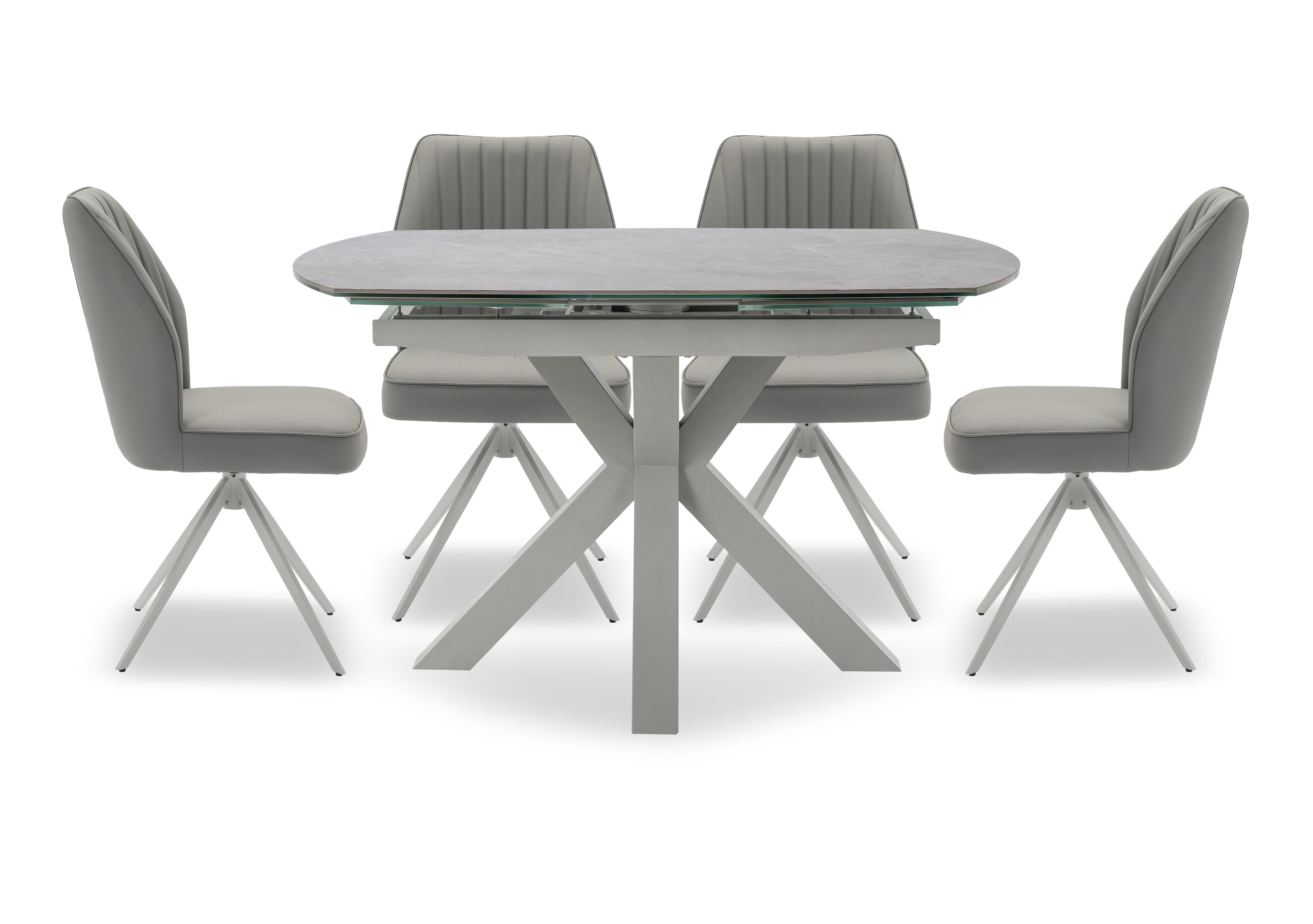 Fumo Swivel Extending Dining Table and 4 Faux Leather Swivel Dining Chairs in  on Furniture Village