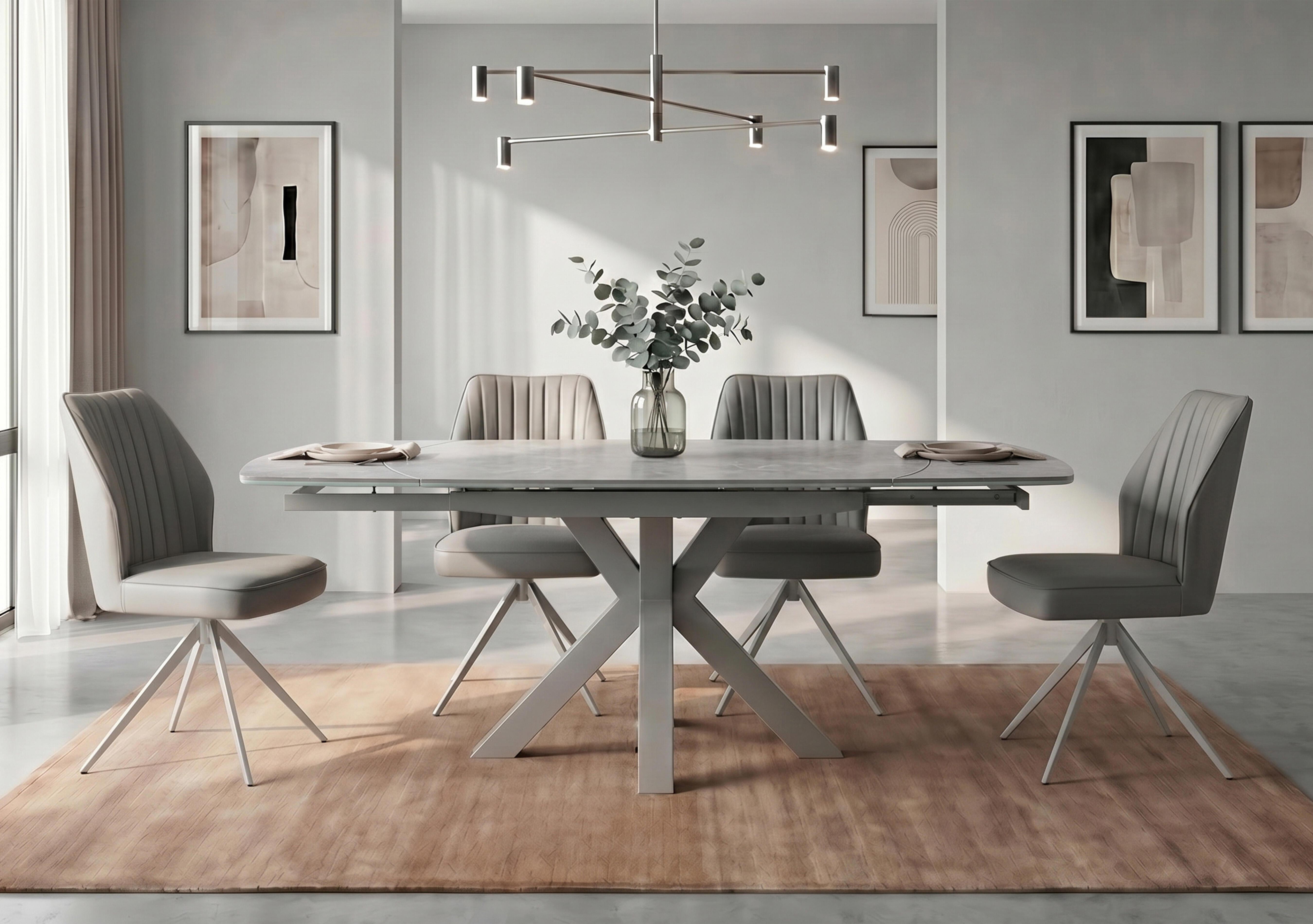 Fumo Swivel Extending Dining Table and 4 Faux Leather Swivel Dining Chairs in  on Furniture Village