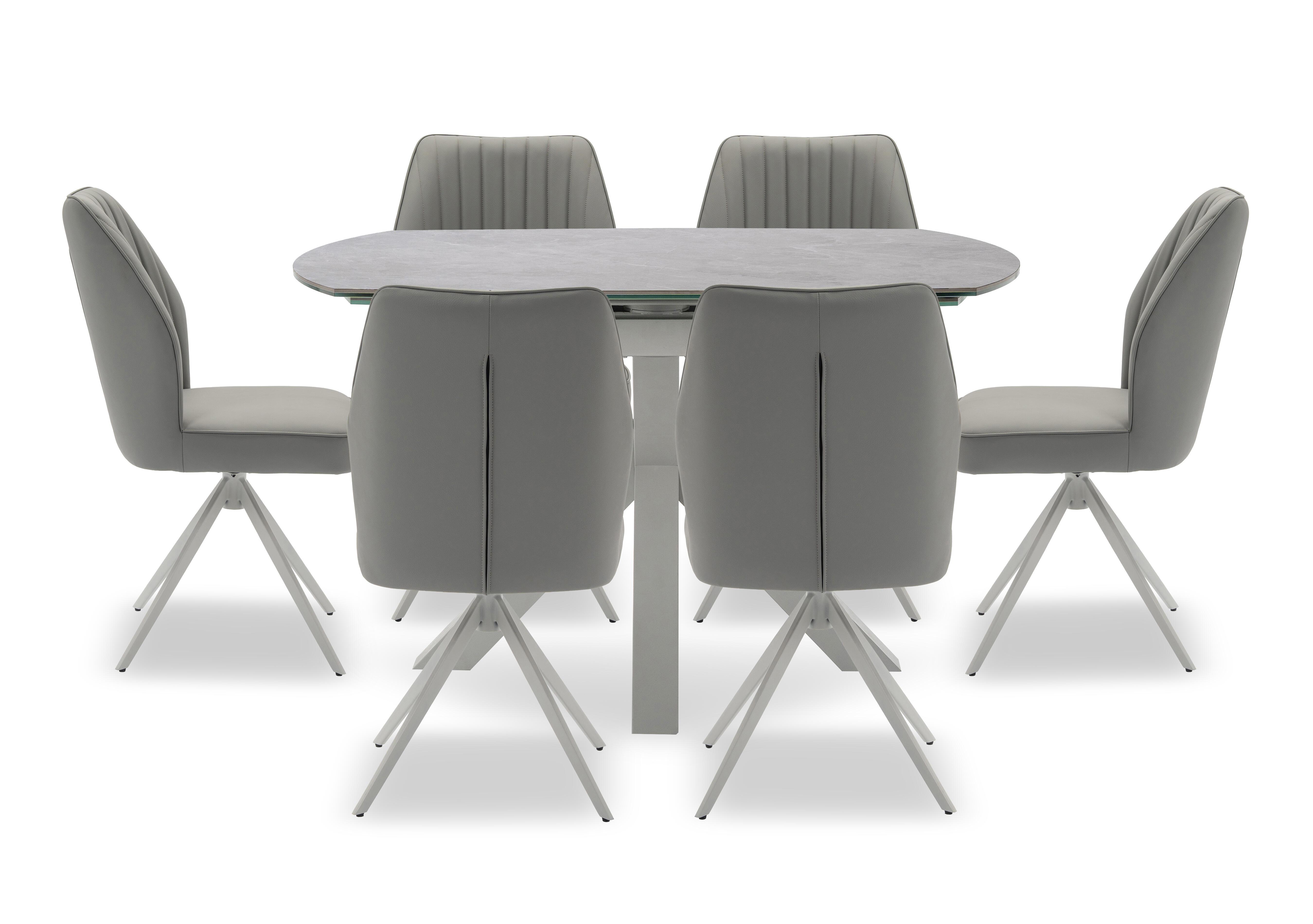 Fumo Swivel Extending Dining Table and 6 Faux Leather Swivel Dining Chairs in  on Furniture Village
