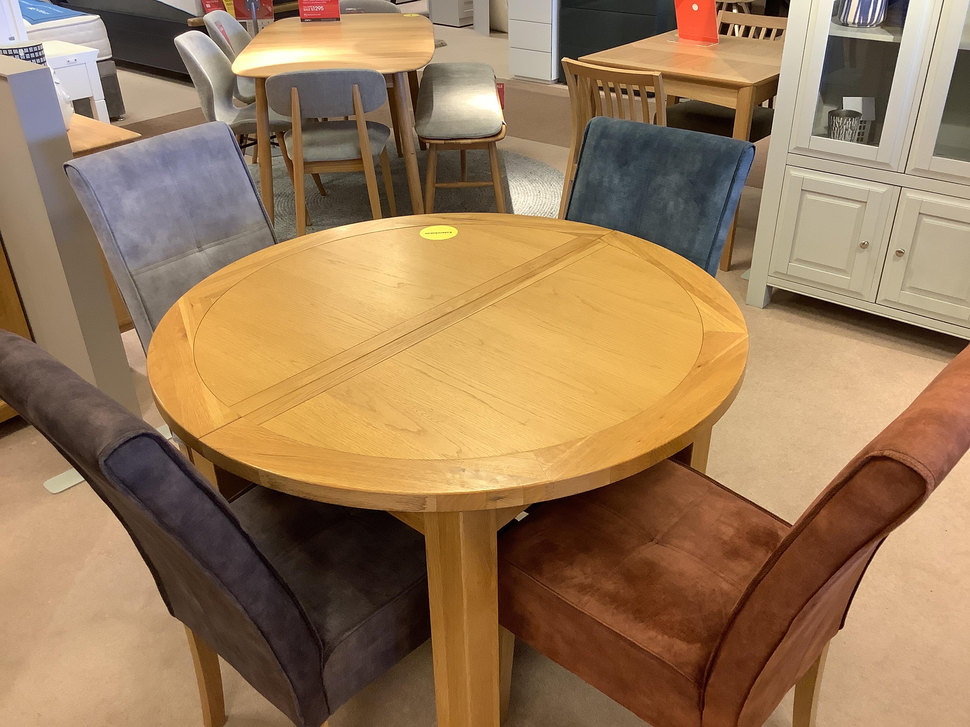 California Round extending table and 4 chairs in  on Furniture Village