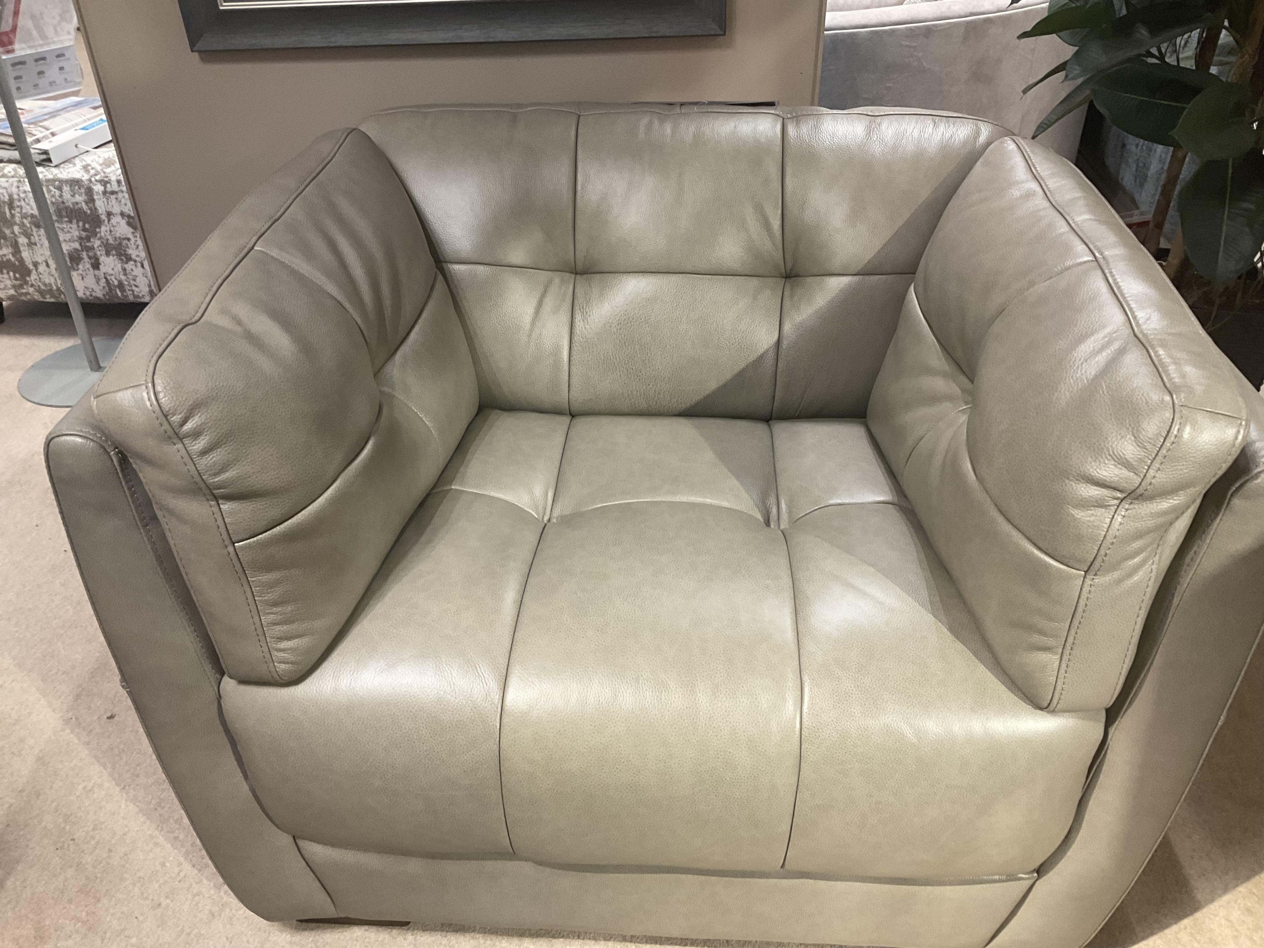 Cartier Snuggle chair and footstool in  on Furniture Village