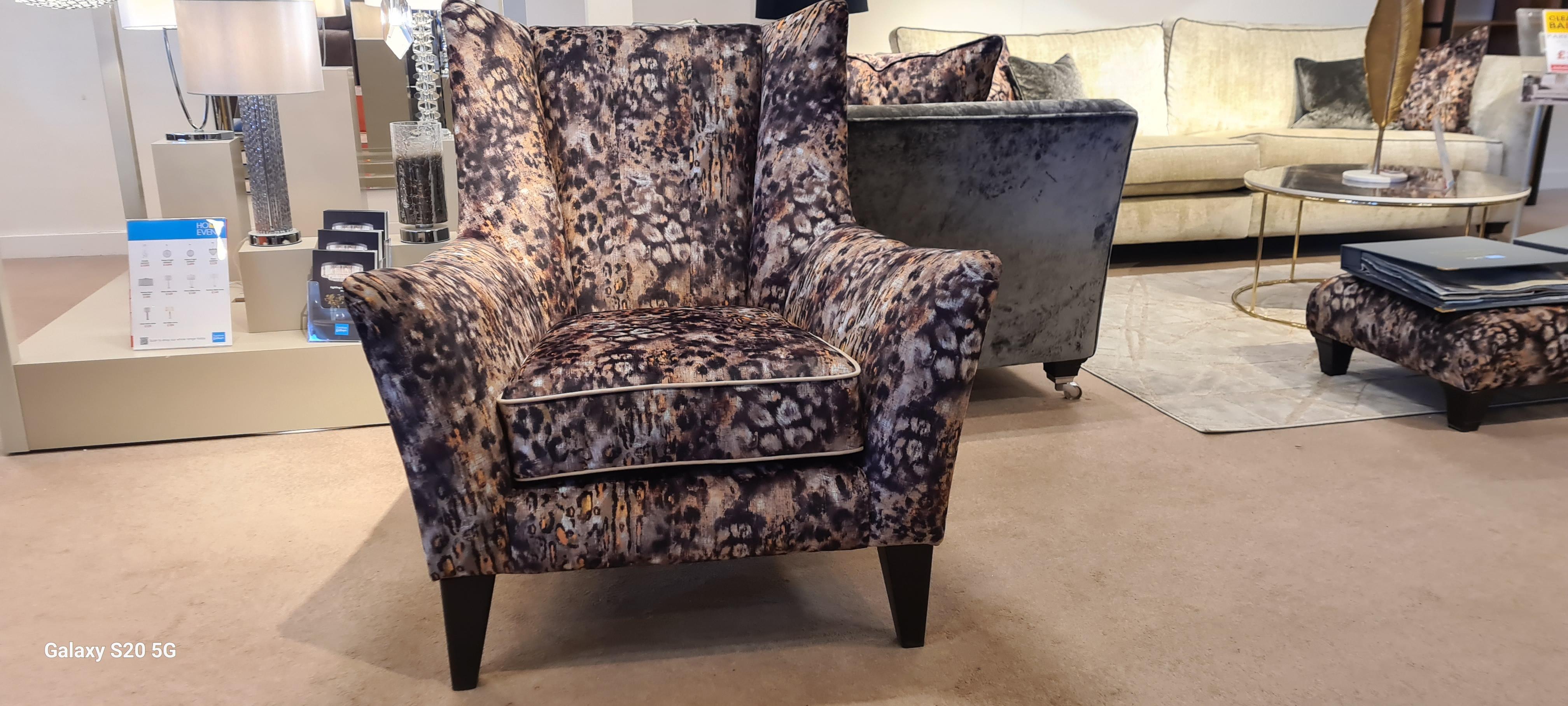 Modern classic flu5ed chair in  on Furniture Village