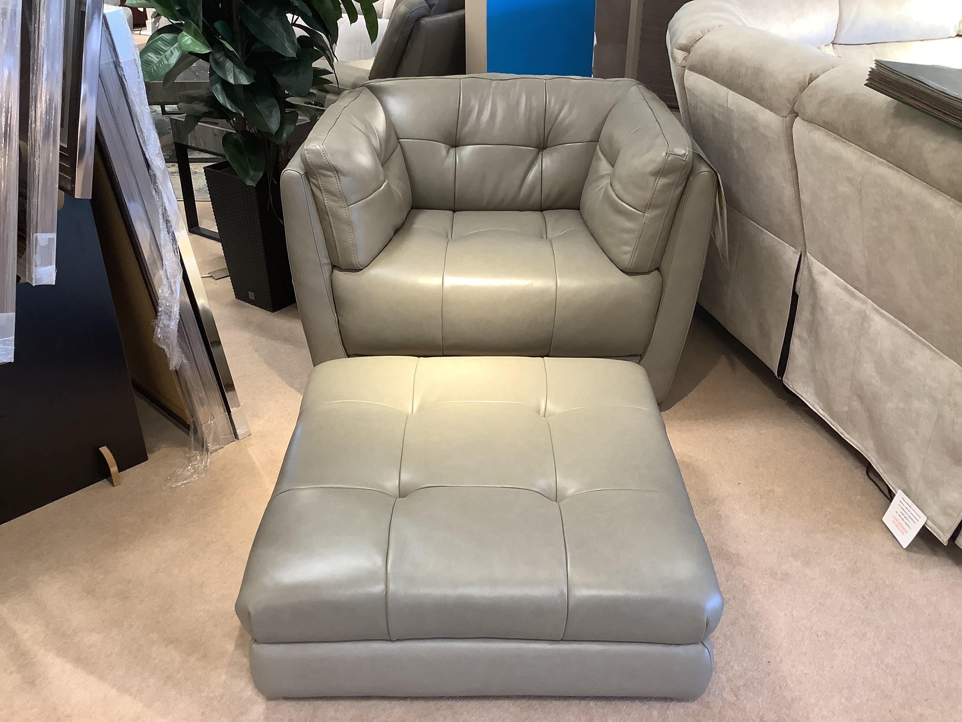 Cartier leather snuggler chair and stool in  on Furniture Village