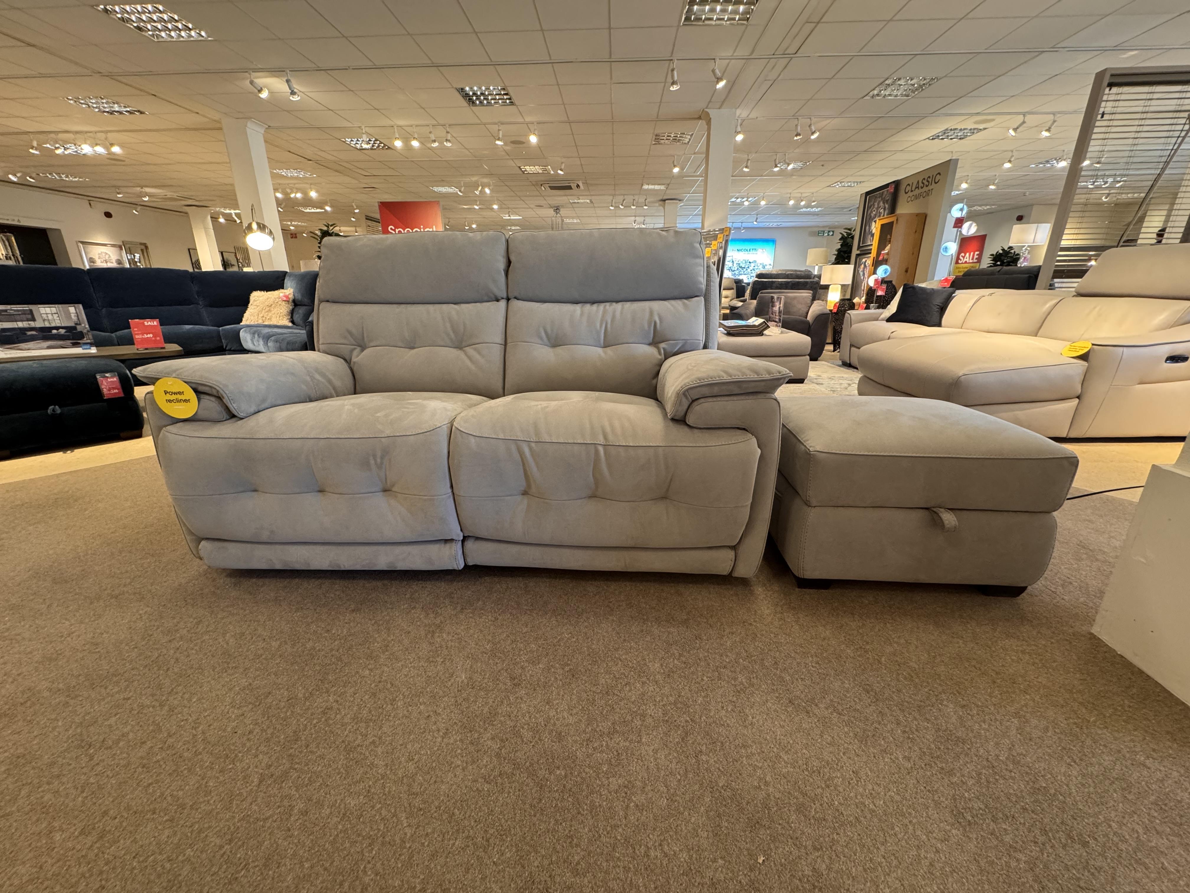Brescia 2 seater power sofa & stool in  on Furniture Village