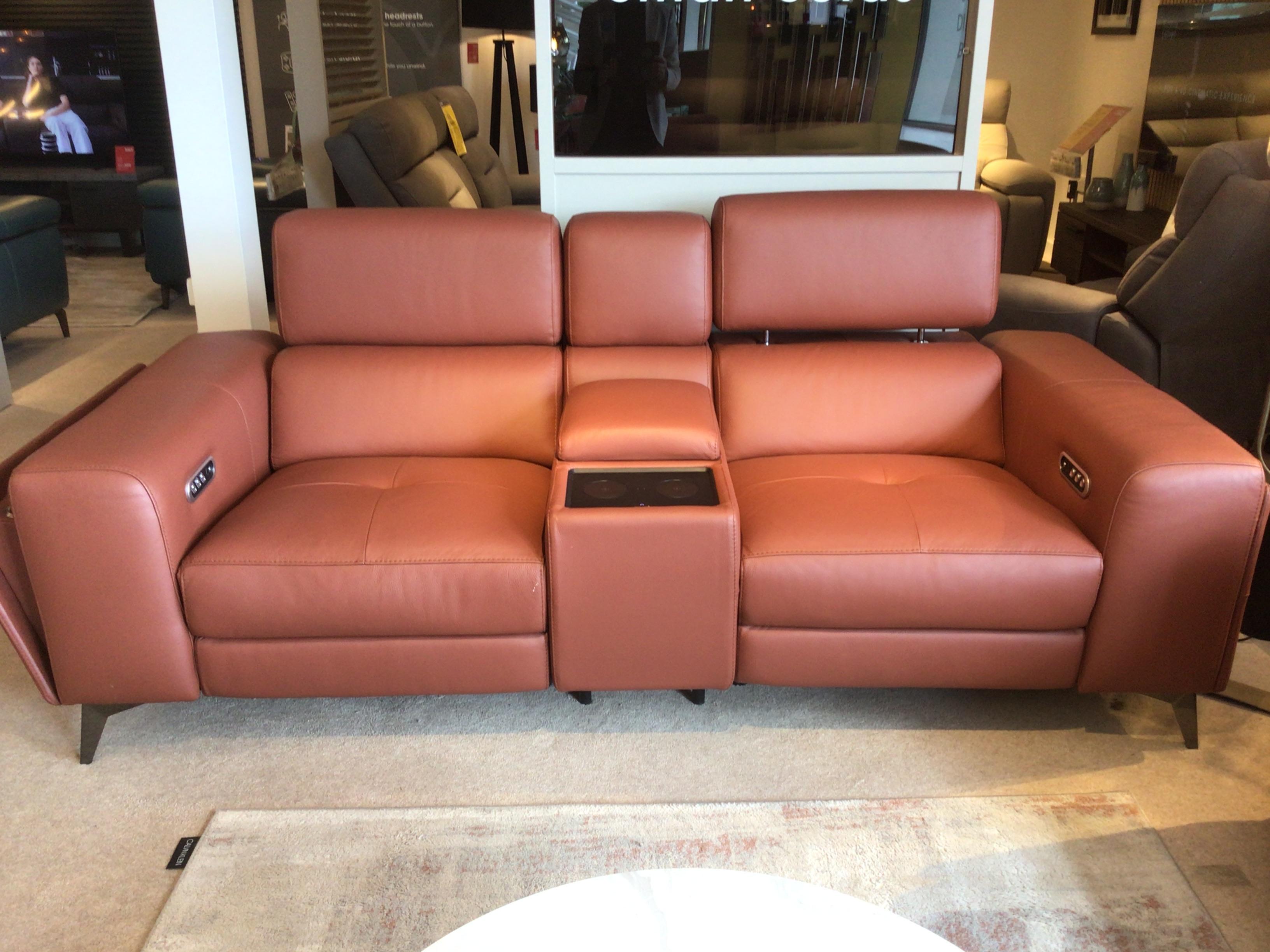 Action leather 2 seater media sofa and footstool in  on Furniture Village