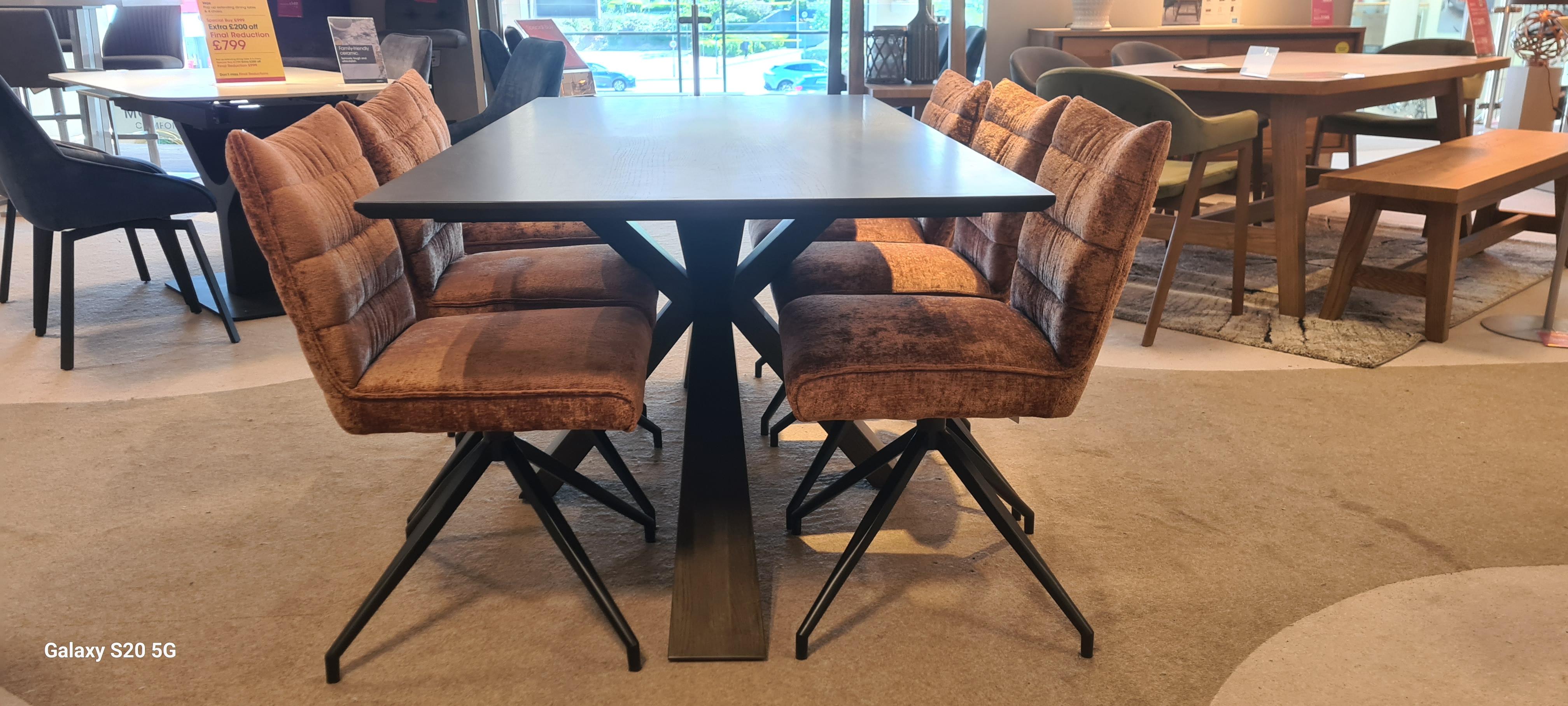 Saigon table and 6 Saturn swivelbdinig chairs in  on Furniture Village