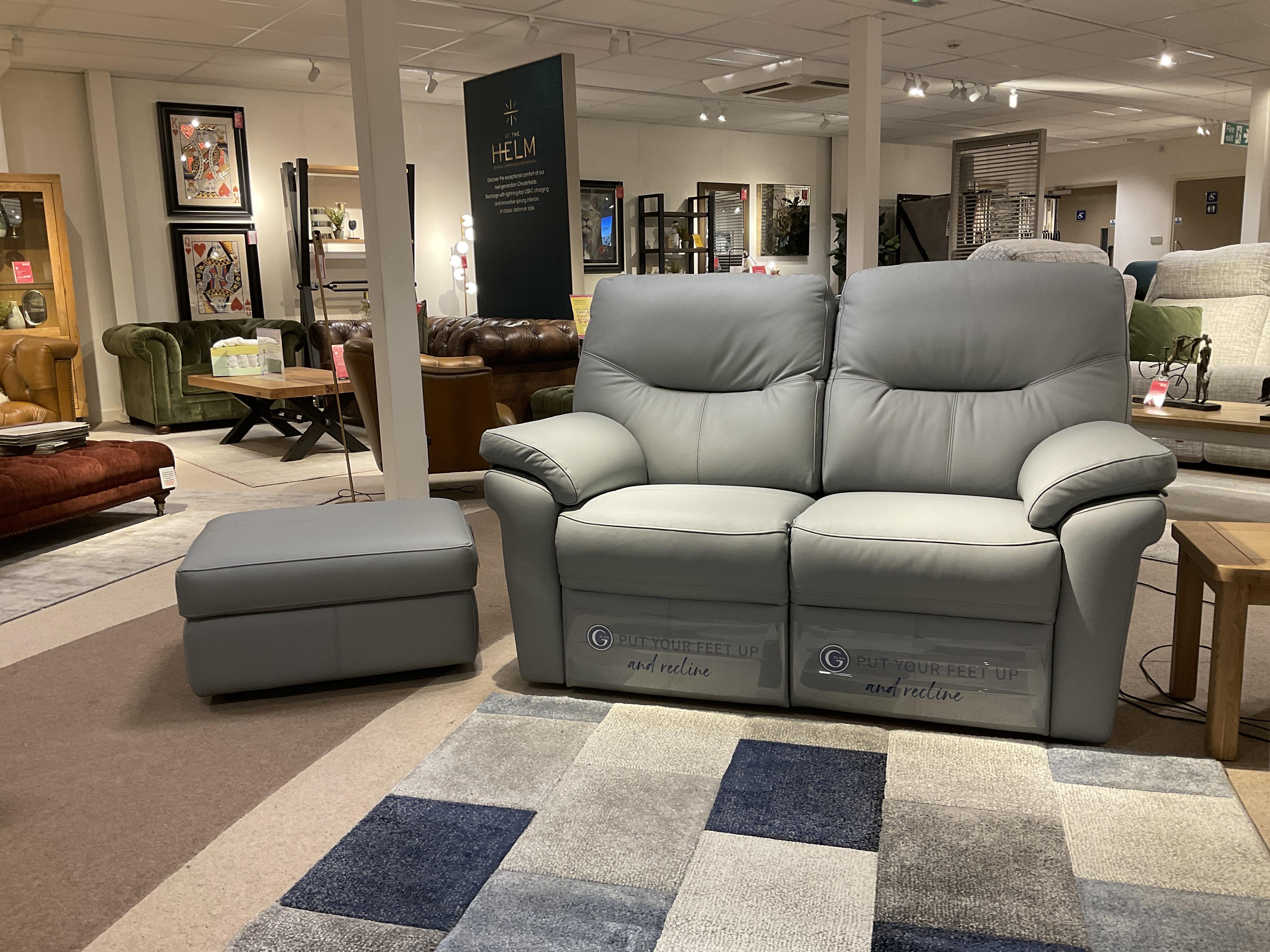 Seattle 2 Seater Leather Power Recliner Sofa & Storage stool in  on Furniture Village
