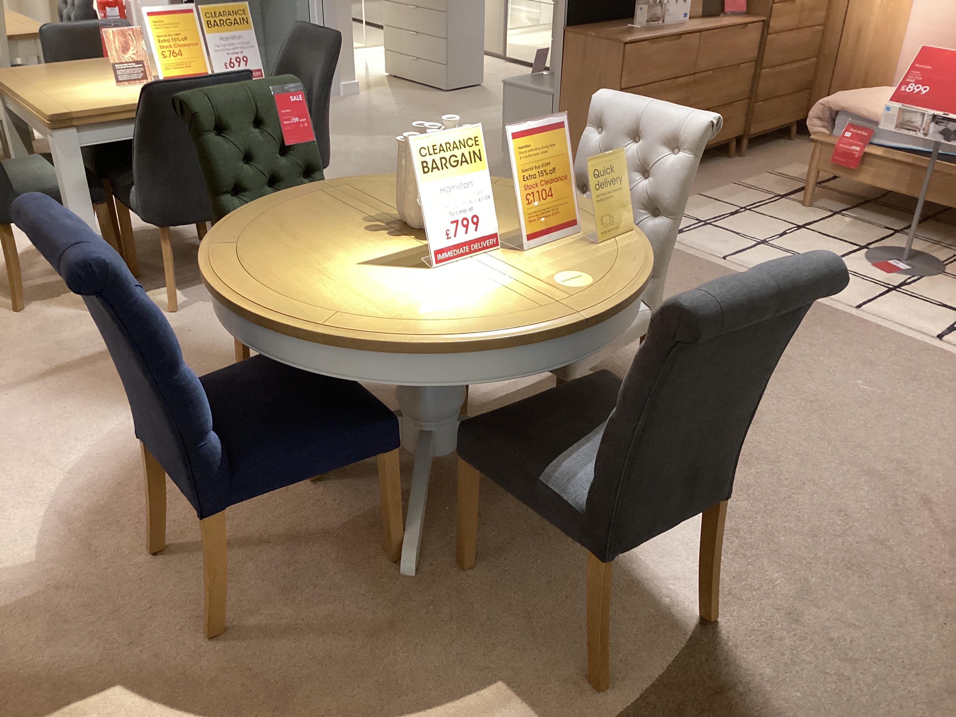 Hamilton round extending dining table with 4 chairs in  on Furniture Village