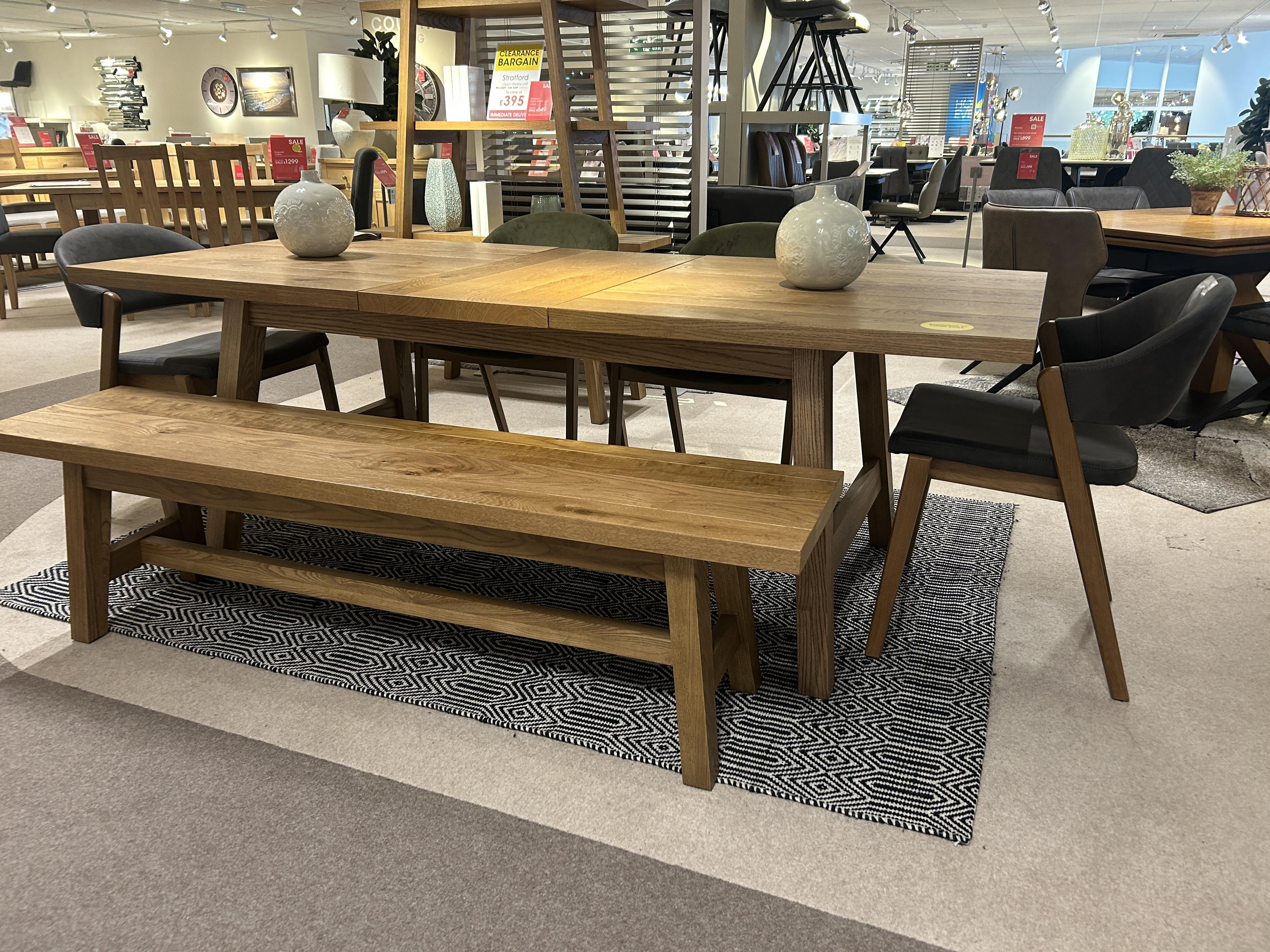 Stratford Ext  table with 4 chairs and a bench in  on Furniture Village