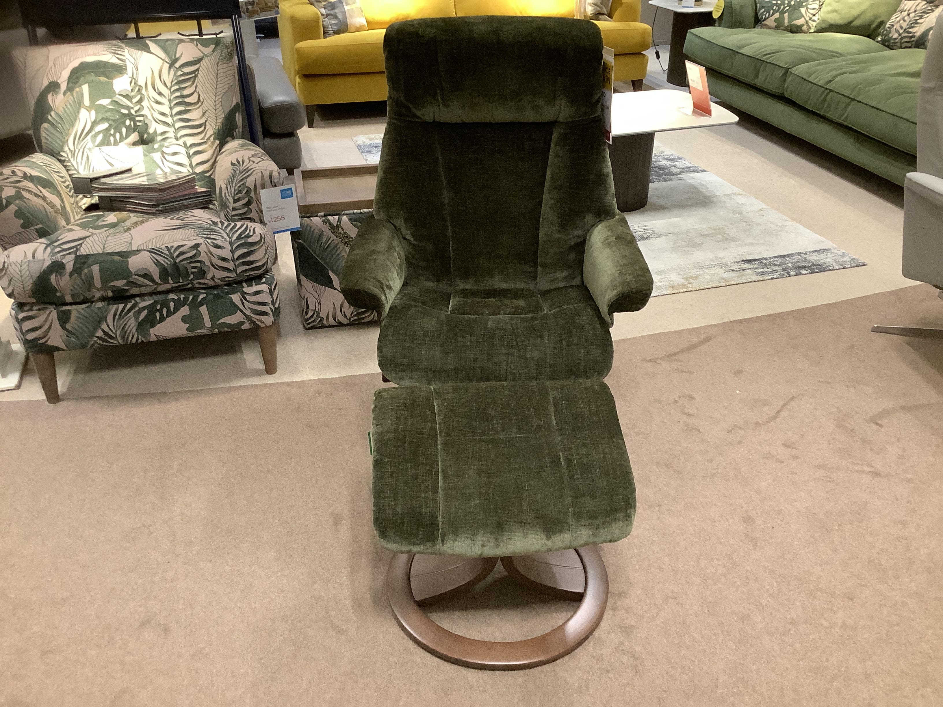 Trosmo medium manual recliner swivel chair and stool in  on Furniture Village