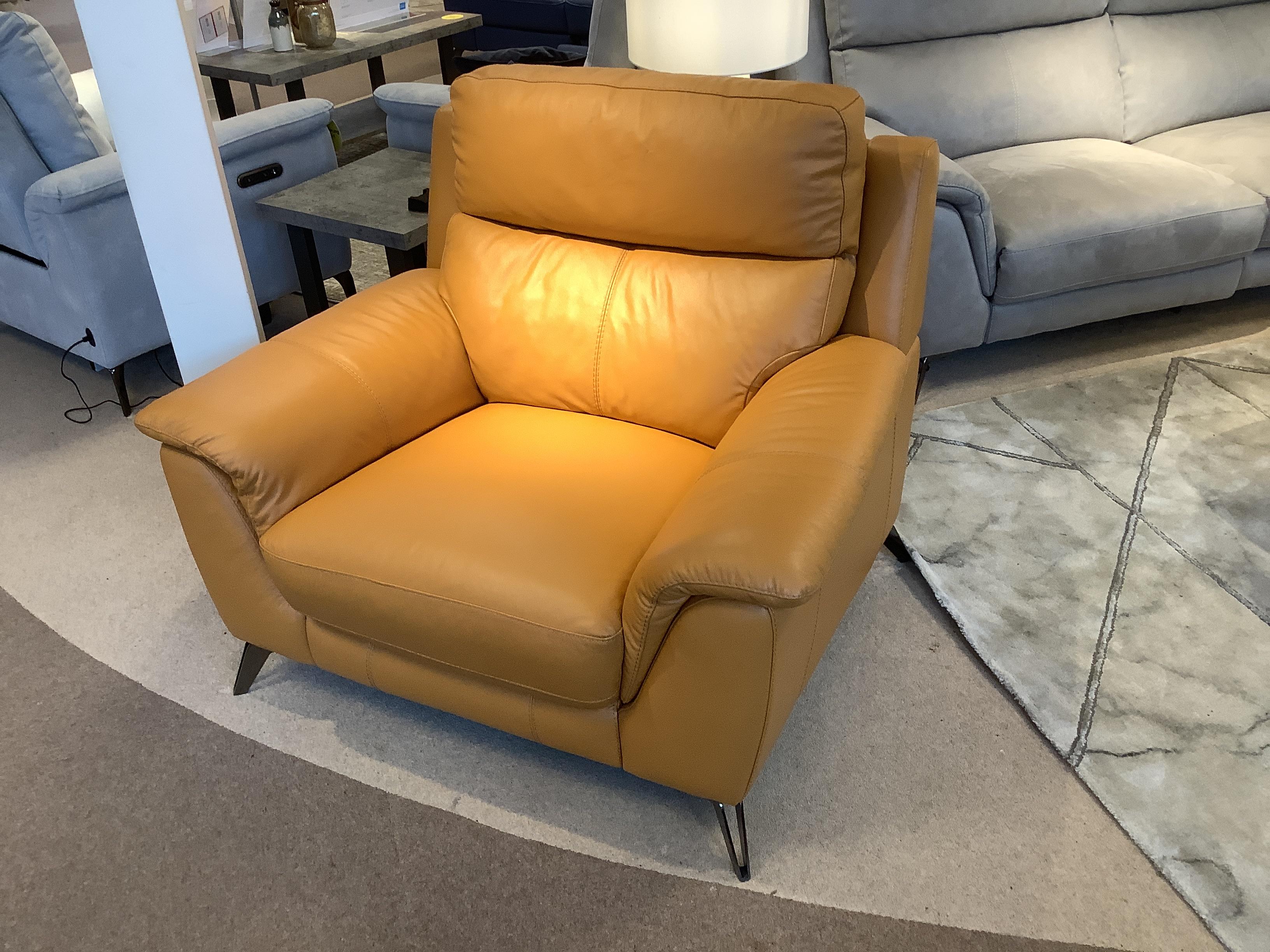 Contempo leather chair and stool in  on Furniture Village