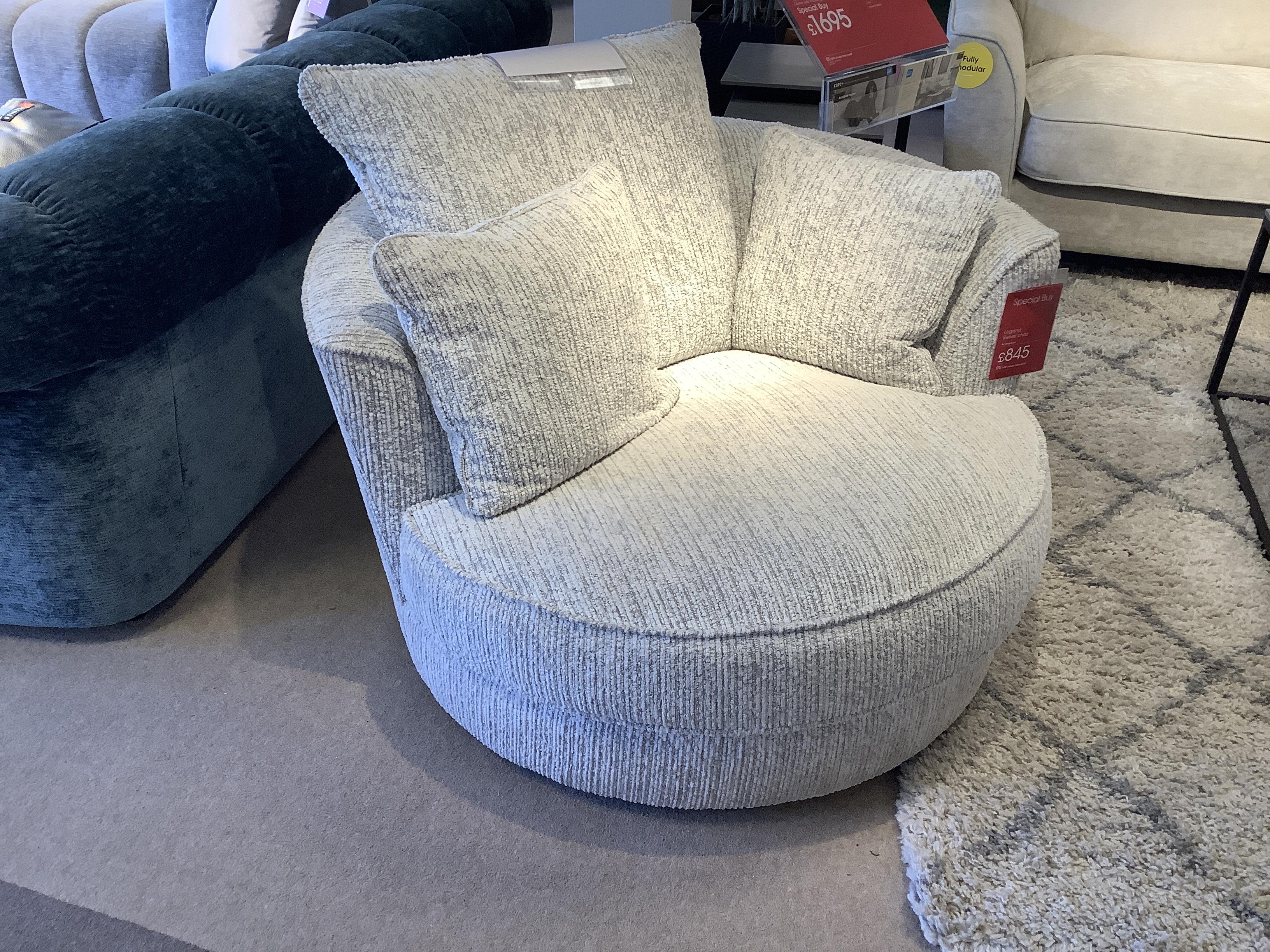 Legend Swivel Chair + Scatters in  on Furniture Village