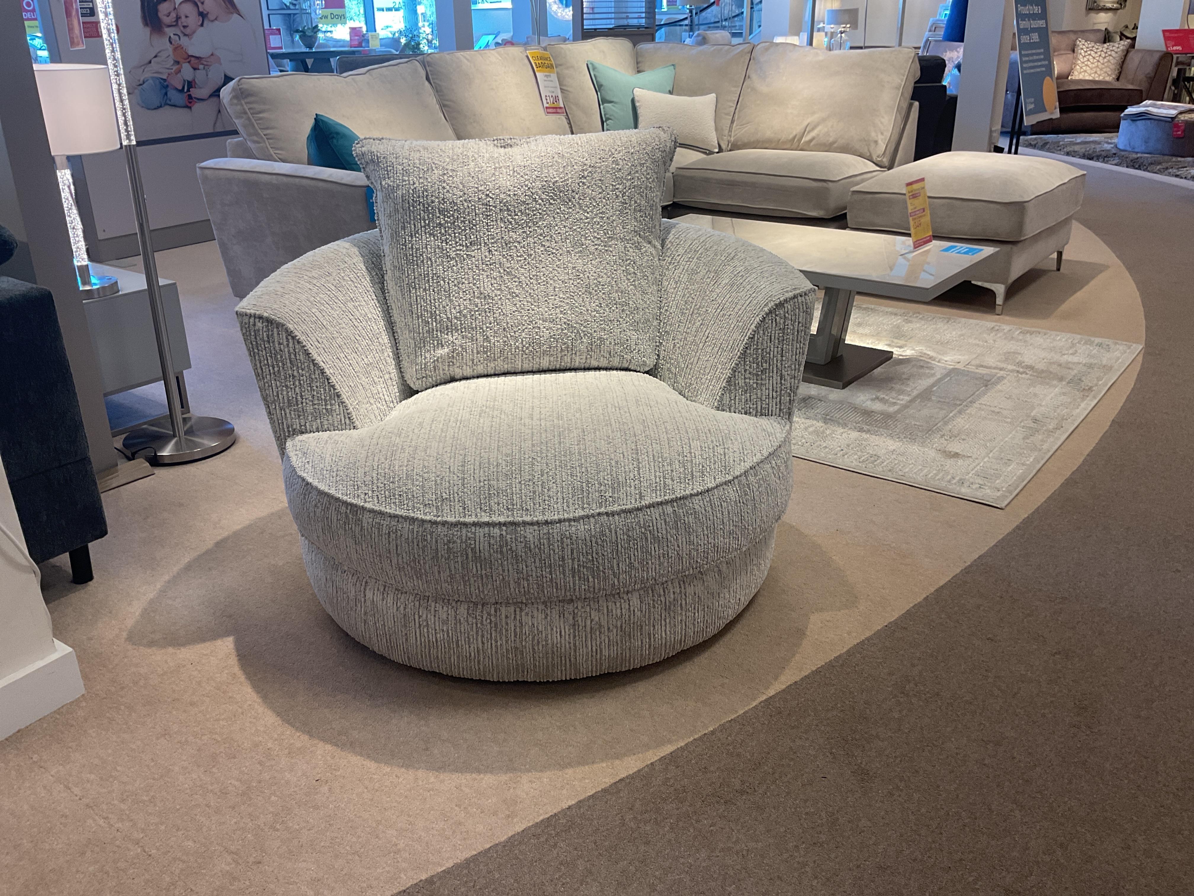 Legend swivel chair and pair of matching scatter cushions in Gabriel Snow fabric in  on Furniture Village
