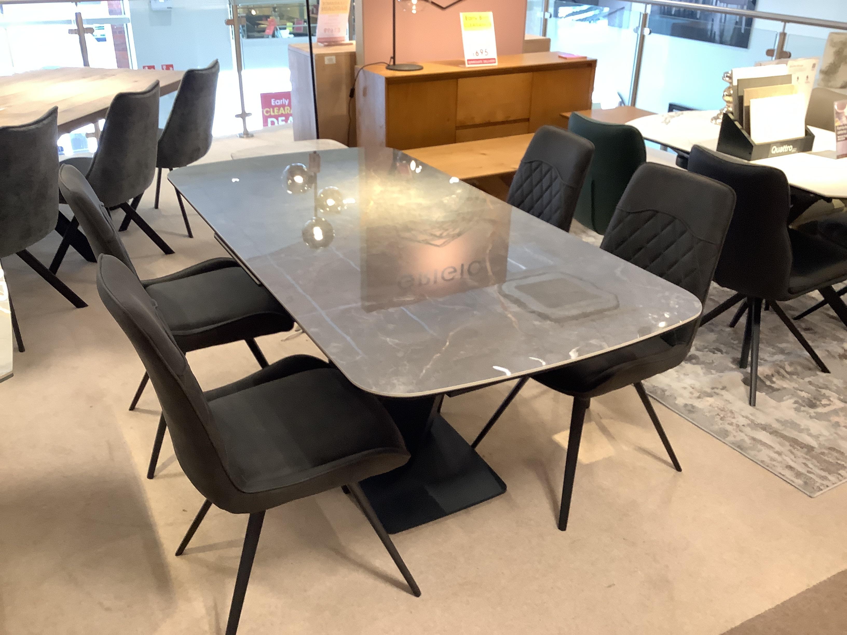 Cupra large pop up table and 4 Warrior chairs in  on Furniture Village