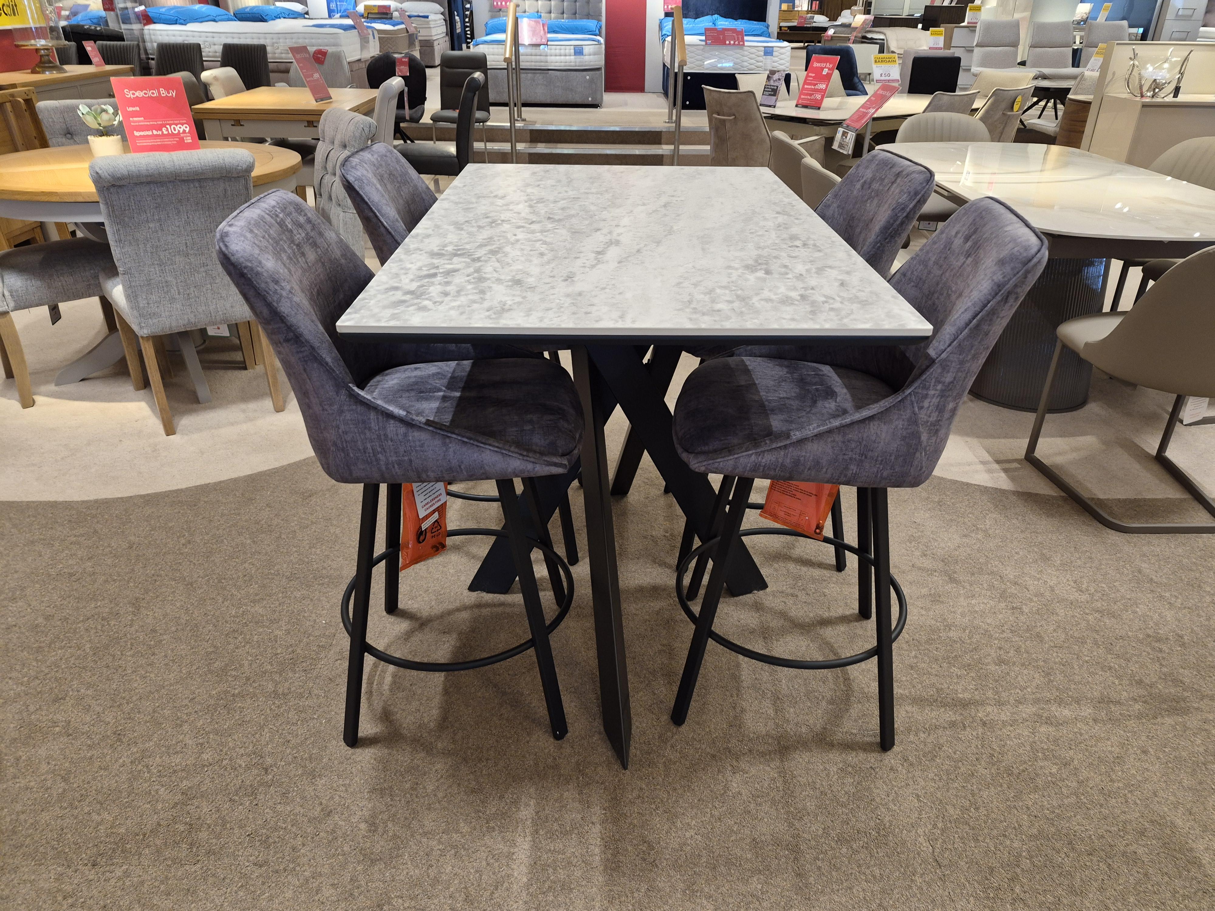 Warrior bar table and 4 Veja swivel bar stools in  on Furniture Village