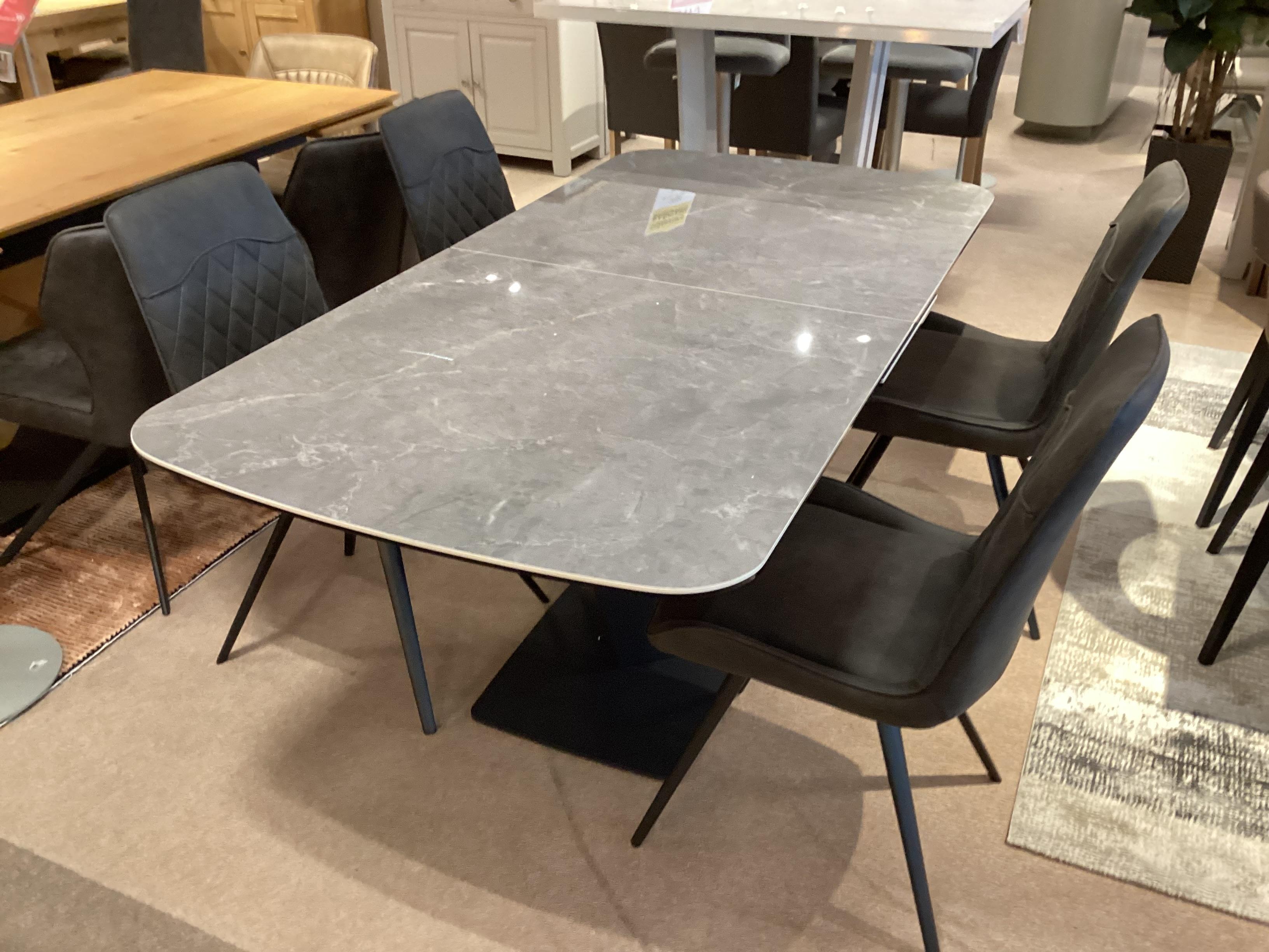 Cupra Large pop up dining table and 4 warrior chairs in  on Furniture Village