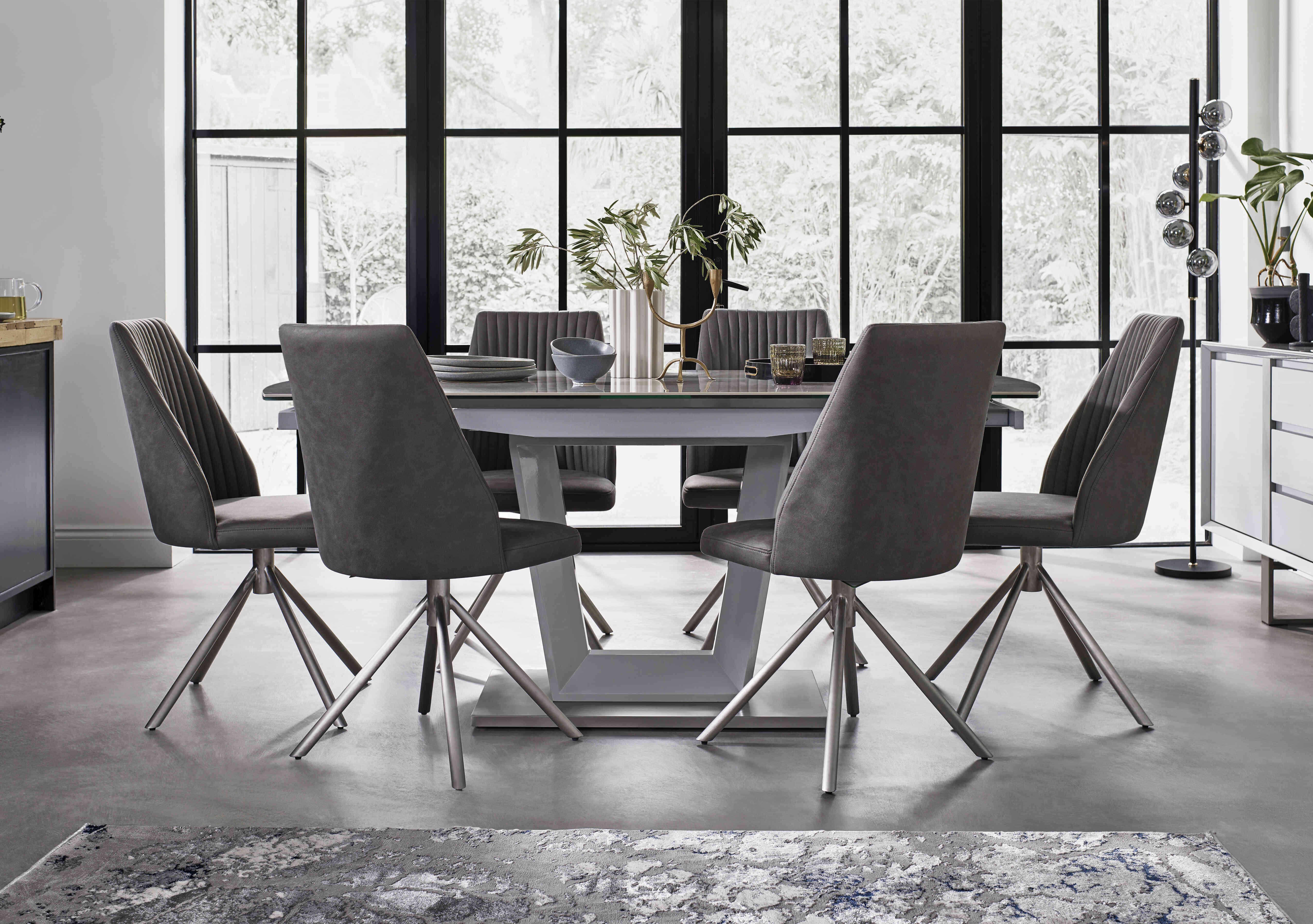 Grigio Swivel Extending Dining Table with 6 Swivel Dining Chairs in  on Furniture Village