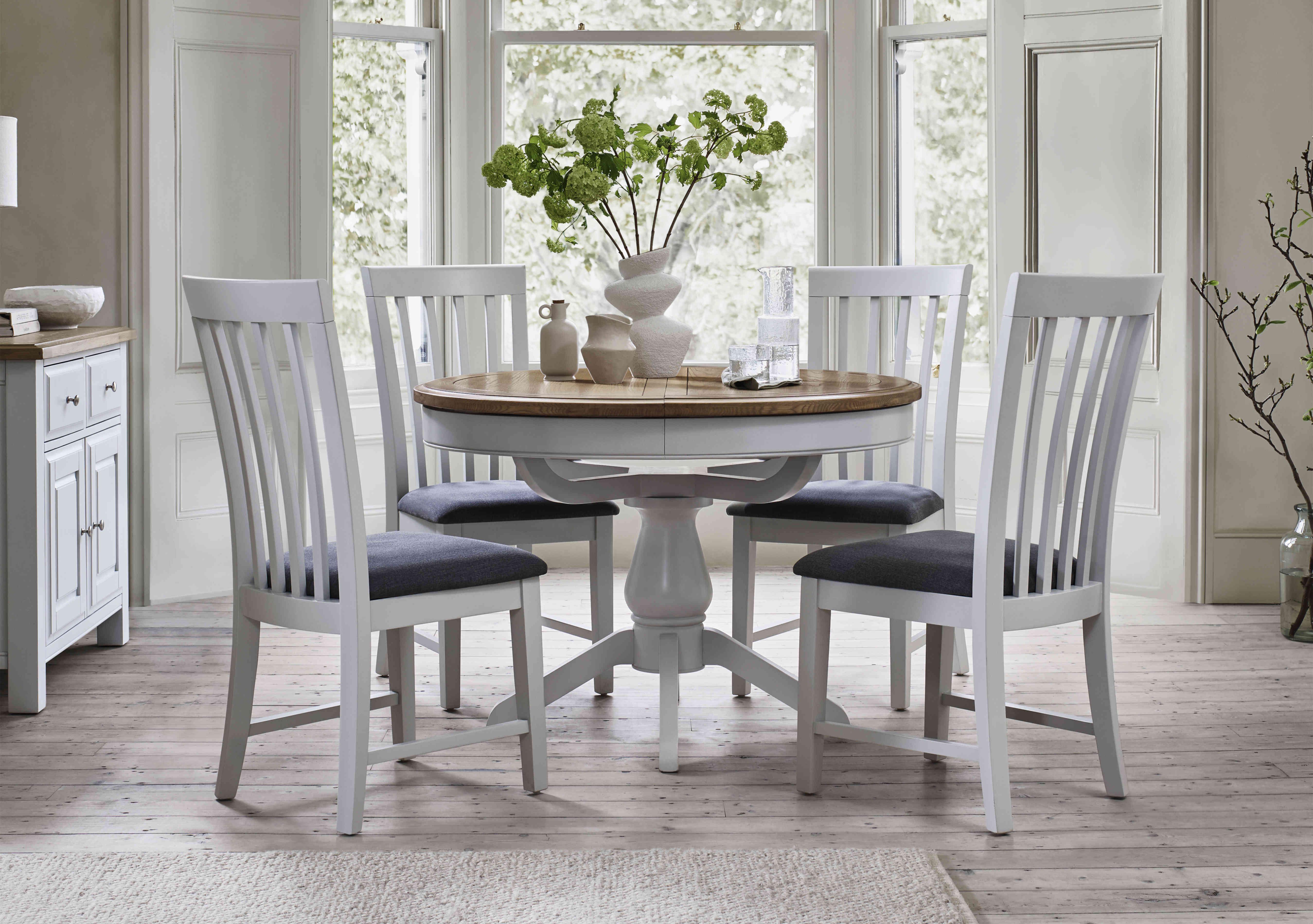 Hamilton Round Extending Dining Table and 4 Wooden Dining Chairs in  on Furniture Village