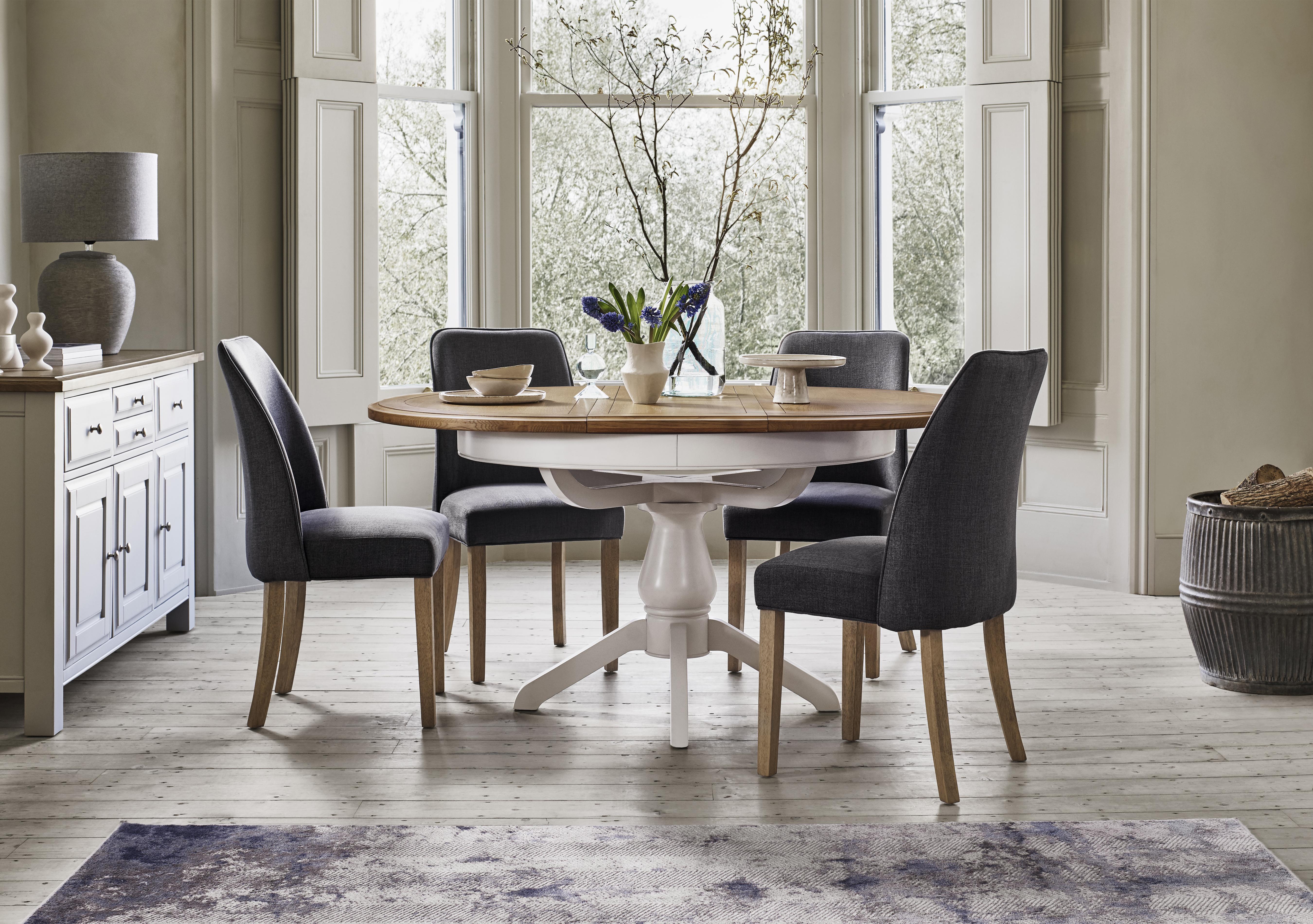 Hamilton Round Extending Dining Table and 4 Fabric Dining Chairs in  on Furniture Village