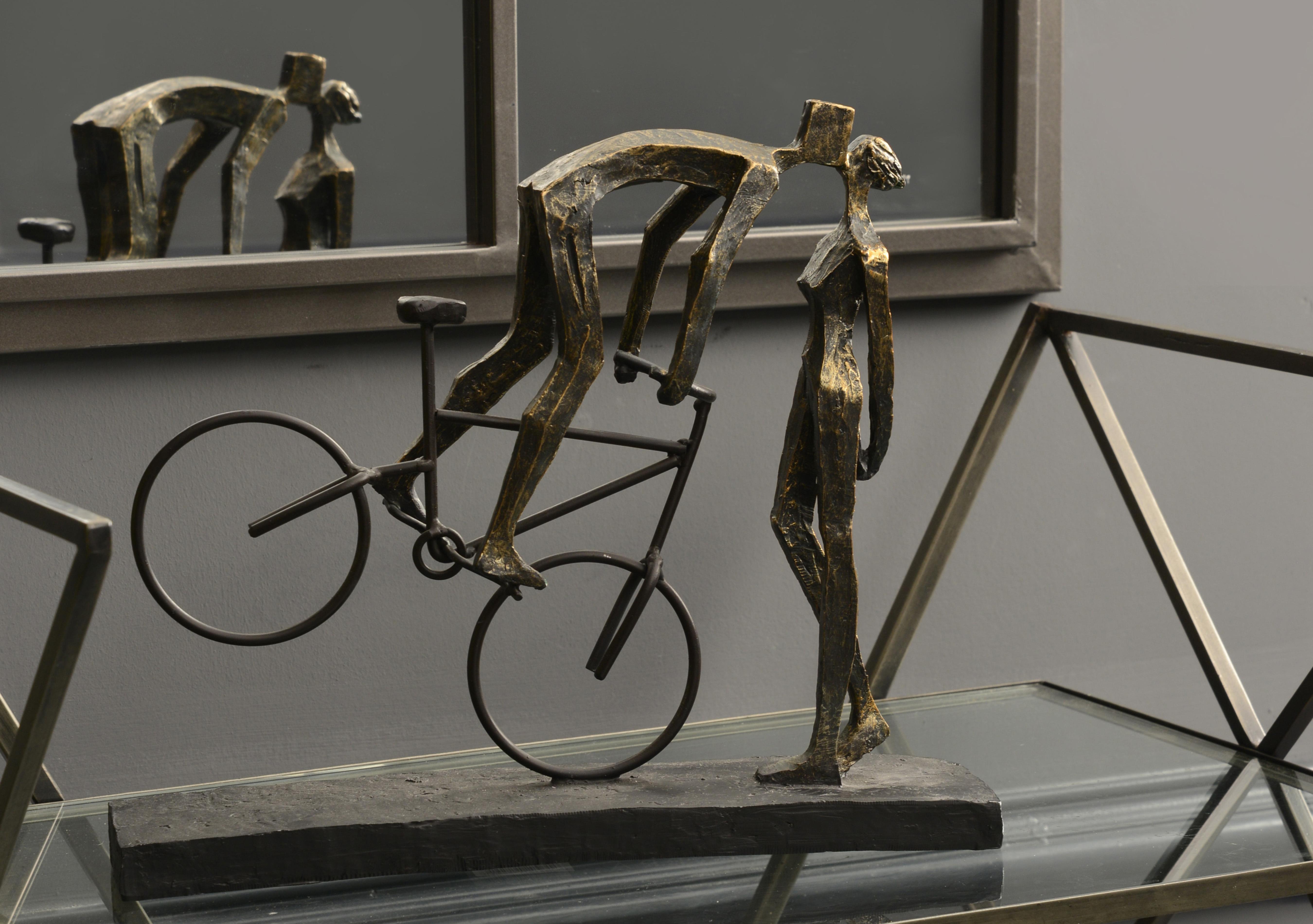 Kissing Couple On Bike Sculpture in  on Furniture Village
