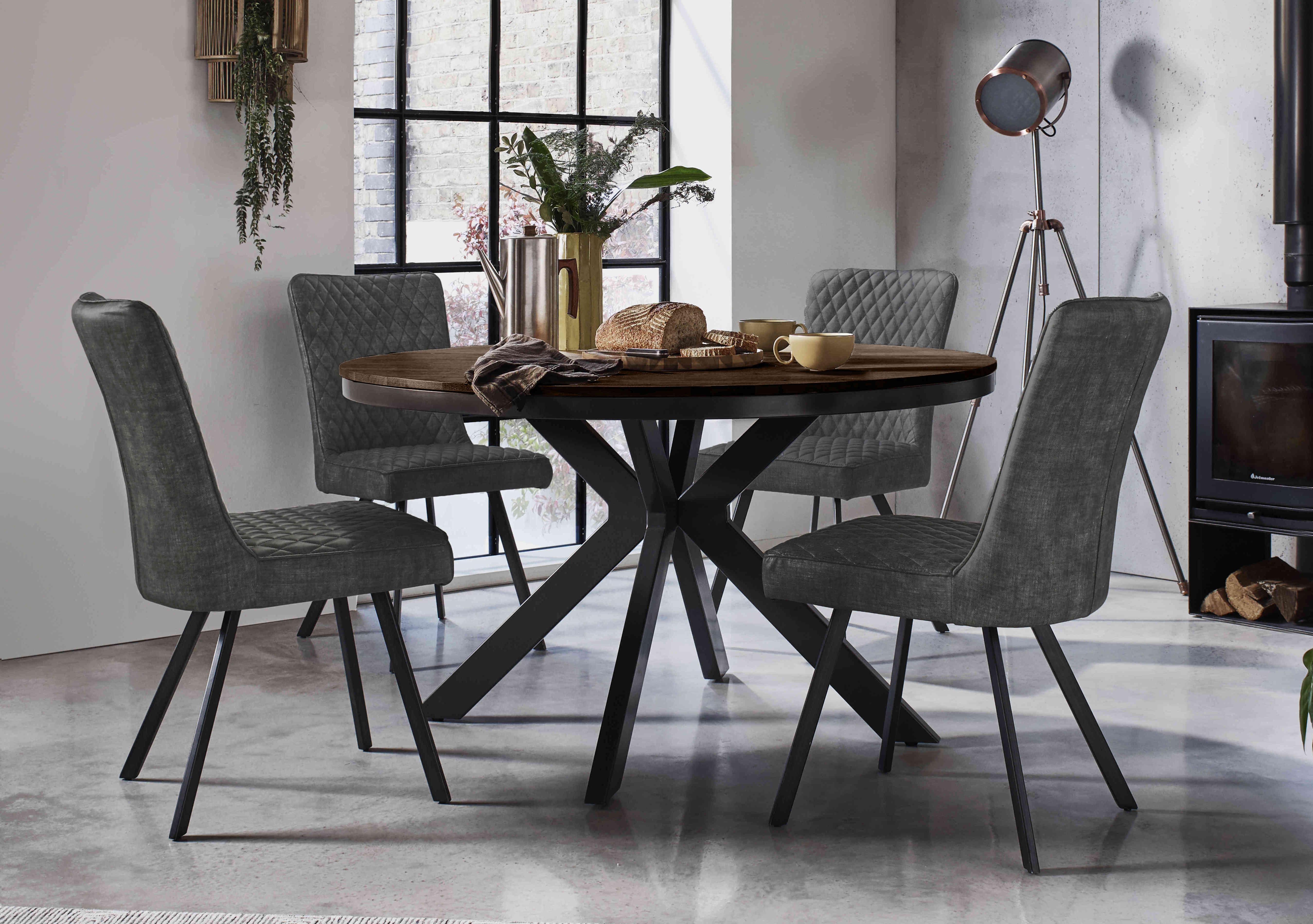 Mars Round Dining Table and 4 Velvet Dining Chairs in  on Furniture Village