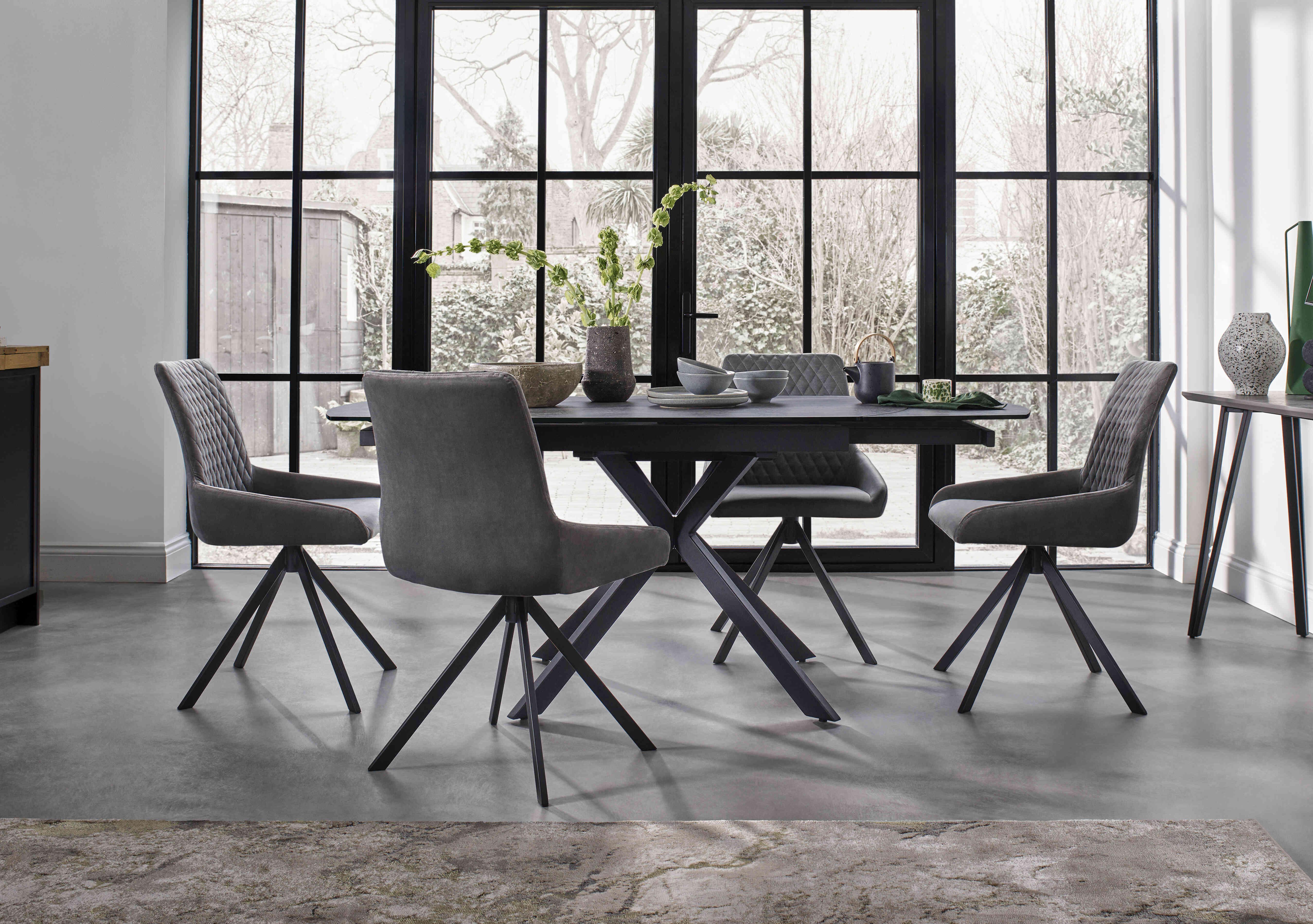 Matteo Swivel Dining Table with 4 Velvet Dining Chairs in  on Furniture Village