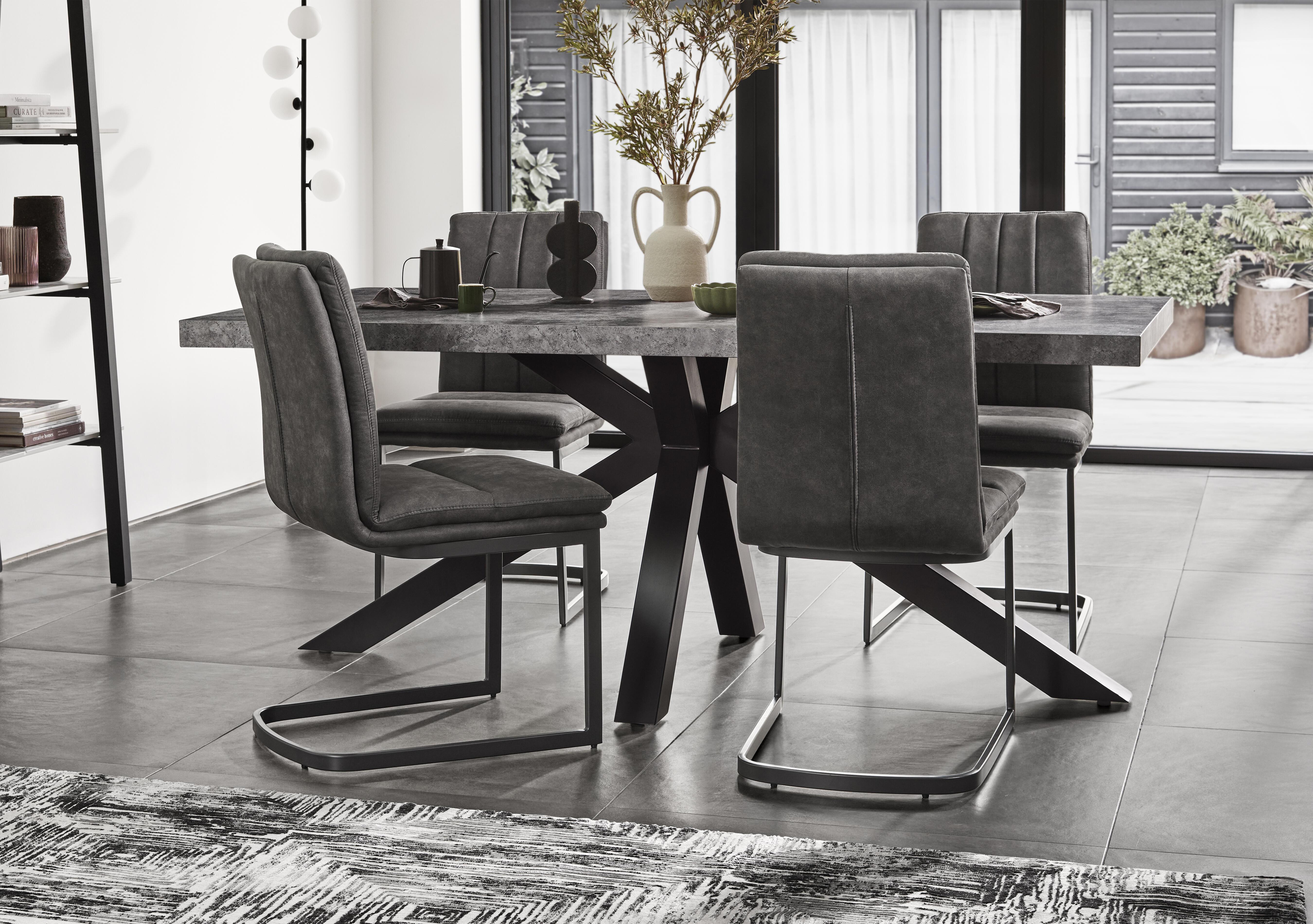 Moon Star Base Dining Table and 4 Upholstered Cantilever Dining Chairs in  on Furniture Village