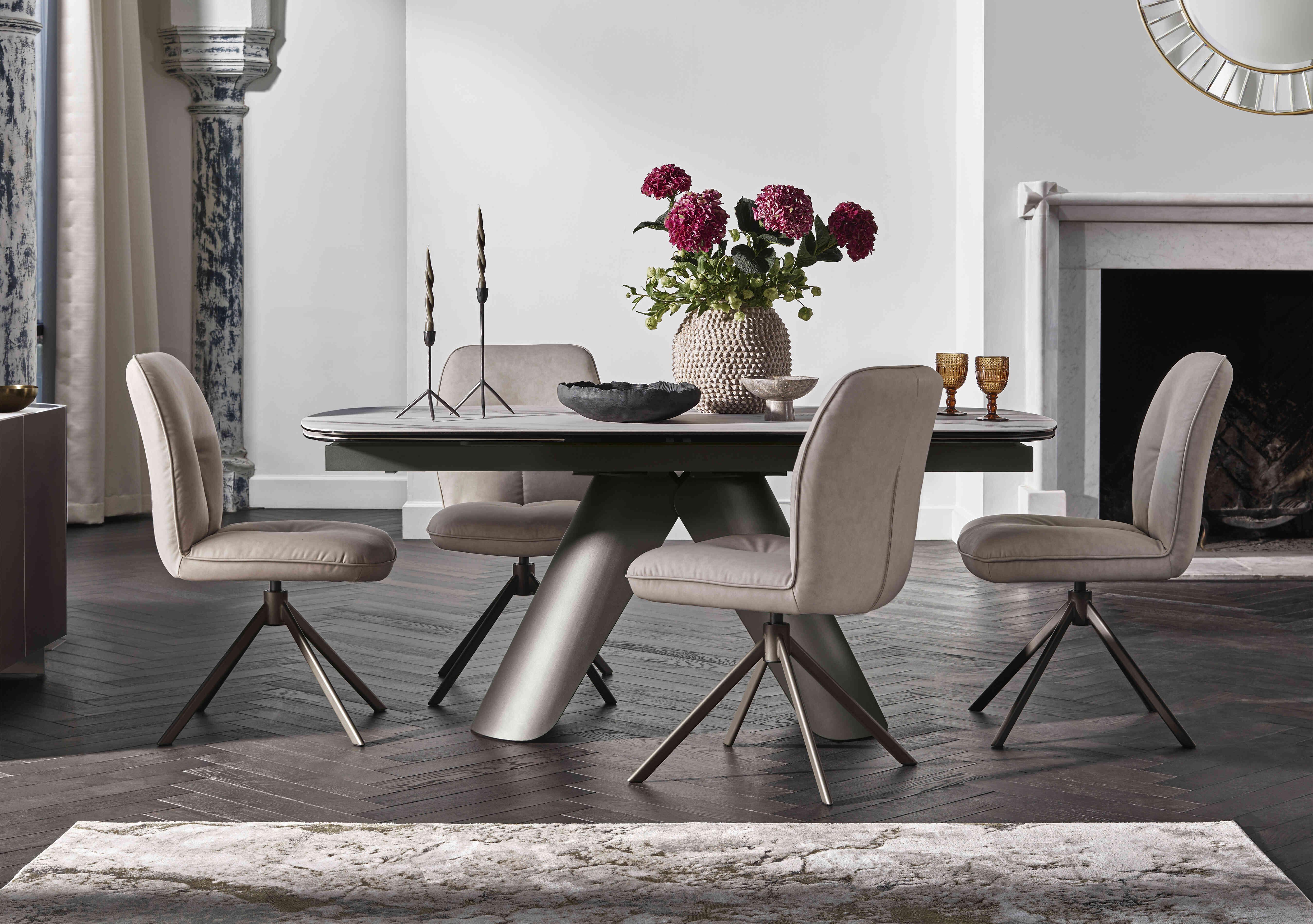 Perla Large Extending Dining Table and 4 Faux Leather Swivel Dining Chairs in  on Furniture Village