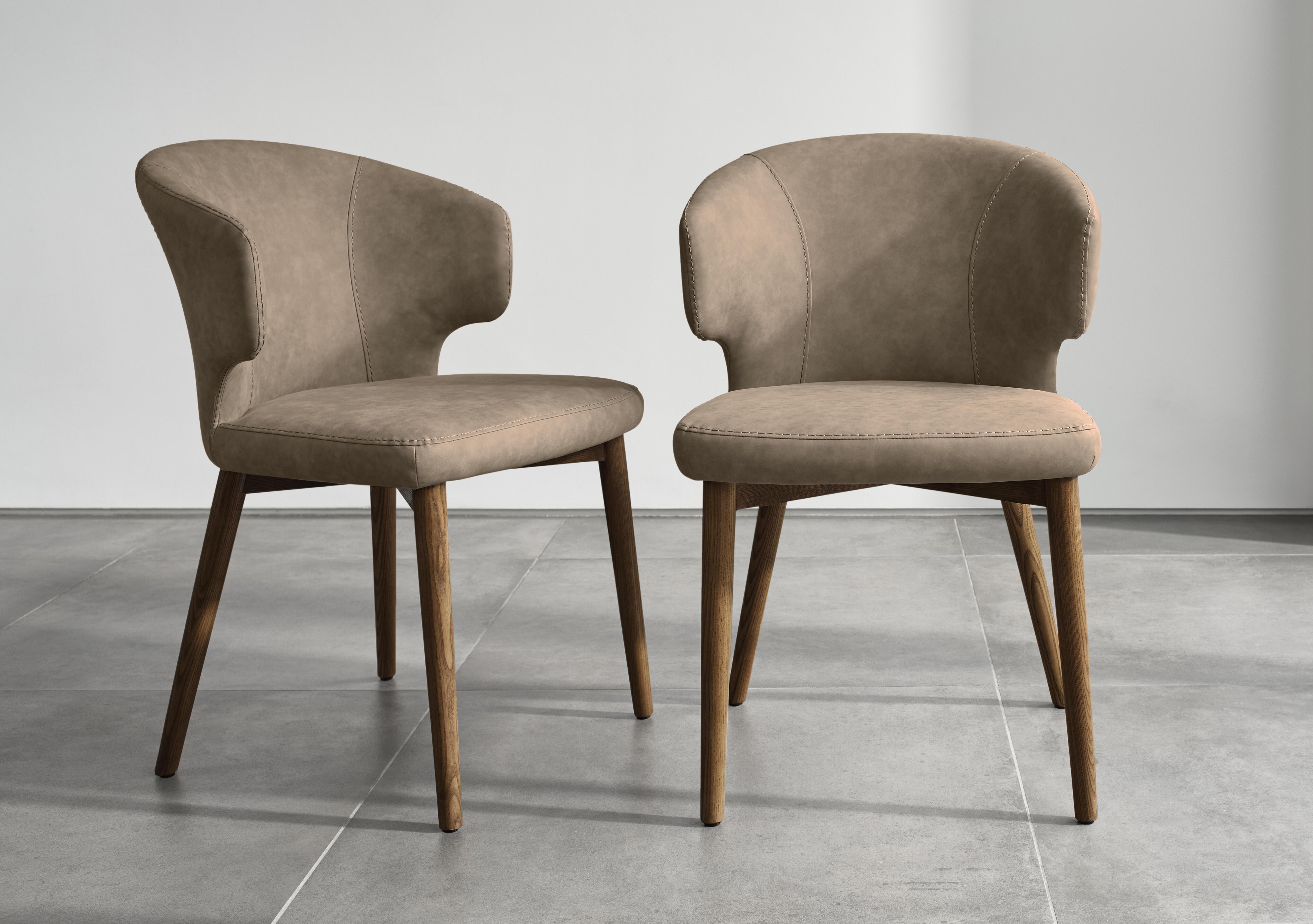 Pien Pair of Faux Leather Dining Chairs with Wooden Legs in  on Furniture Village