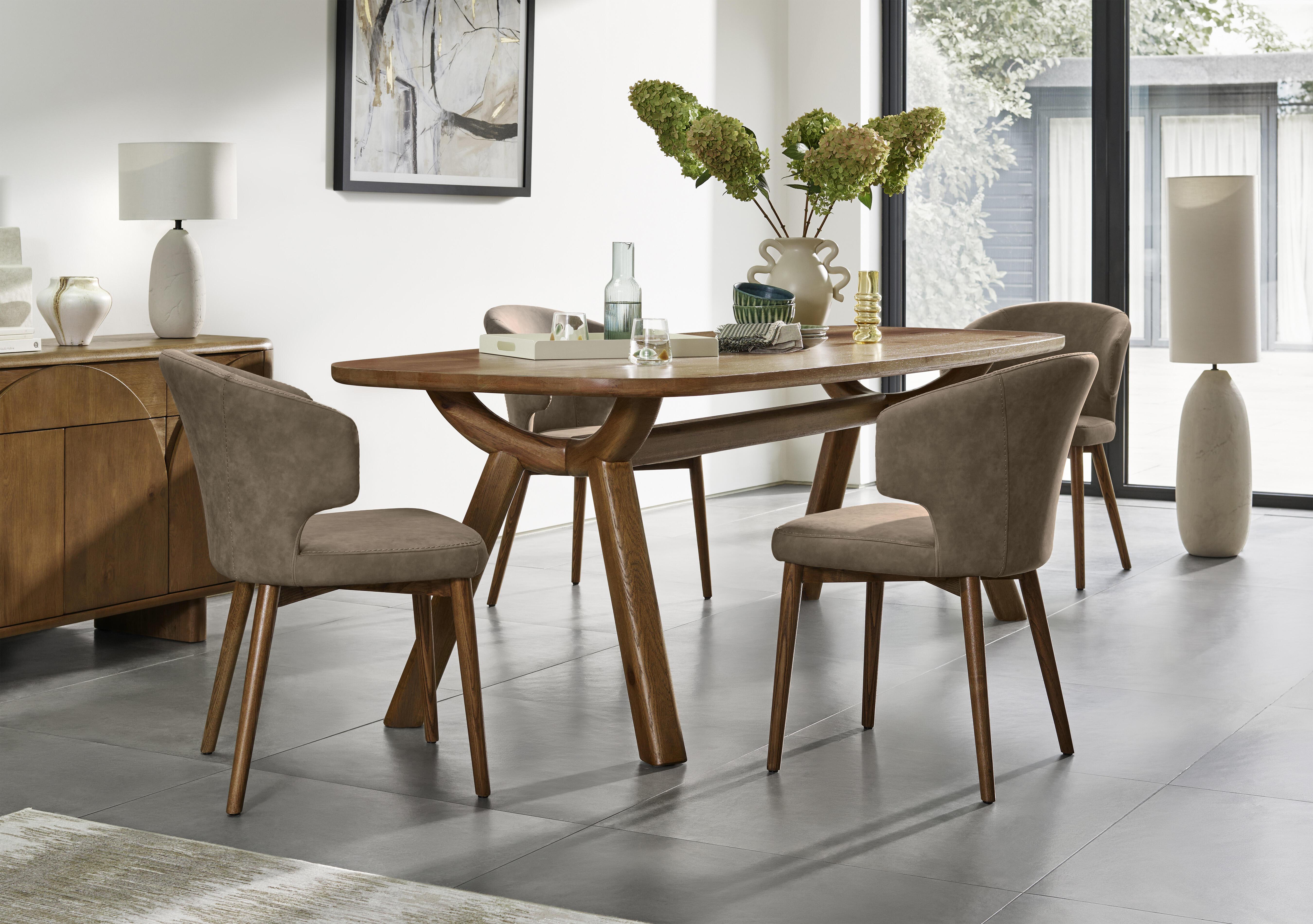 Pien Large Boat Shaped Oak Fixed Dining Table and 4 Faux Leather Dining Chairs with Wooden Legs in  on Furniture Village