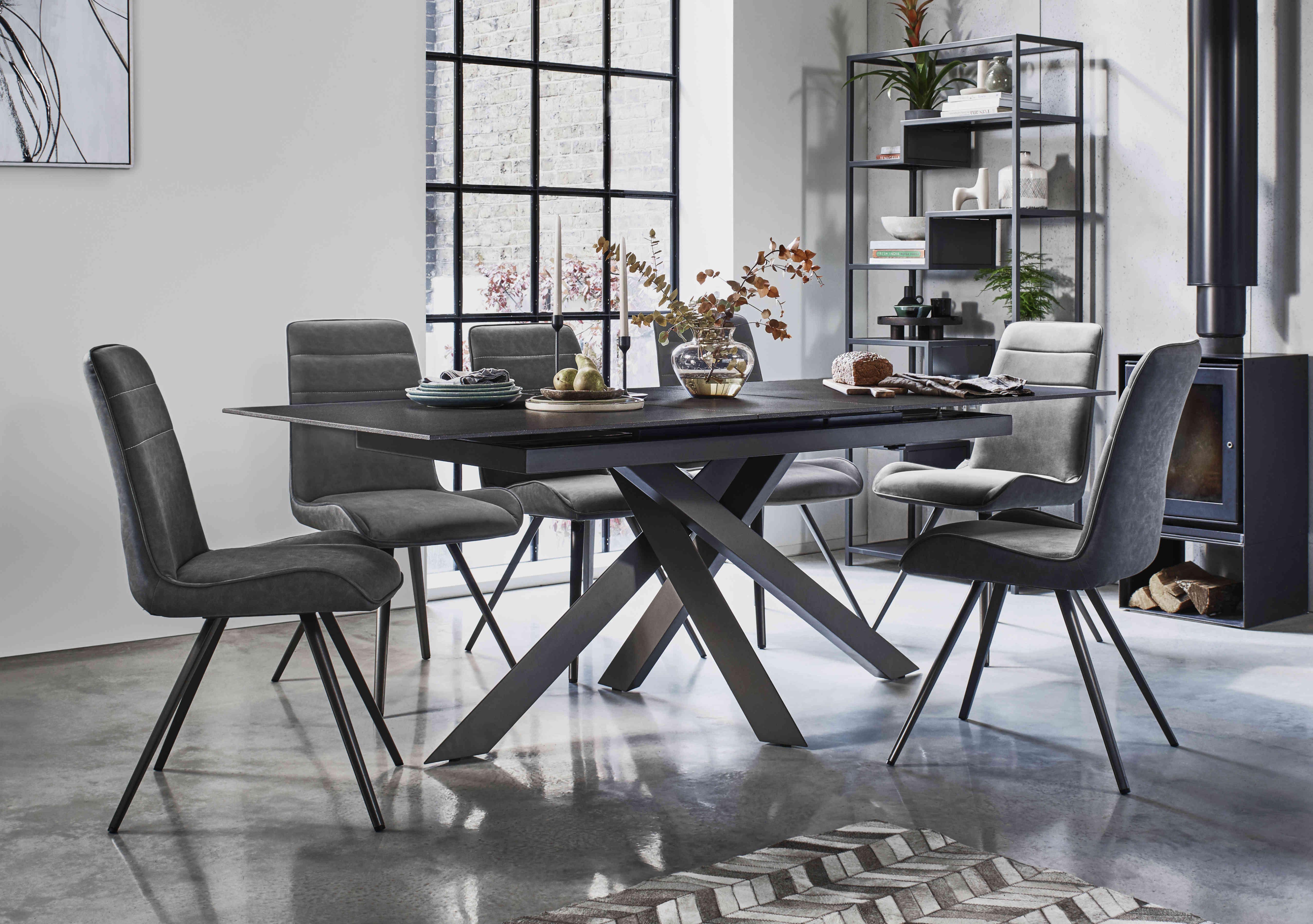Samurai Extending Dining Table and 6 Faux Leather Dining Chairs in  on Furniture Village