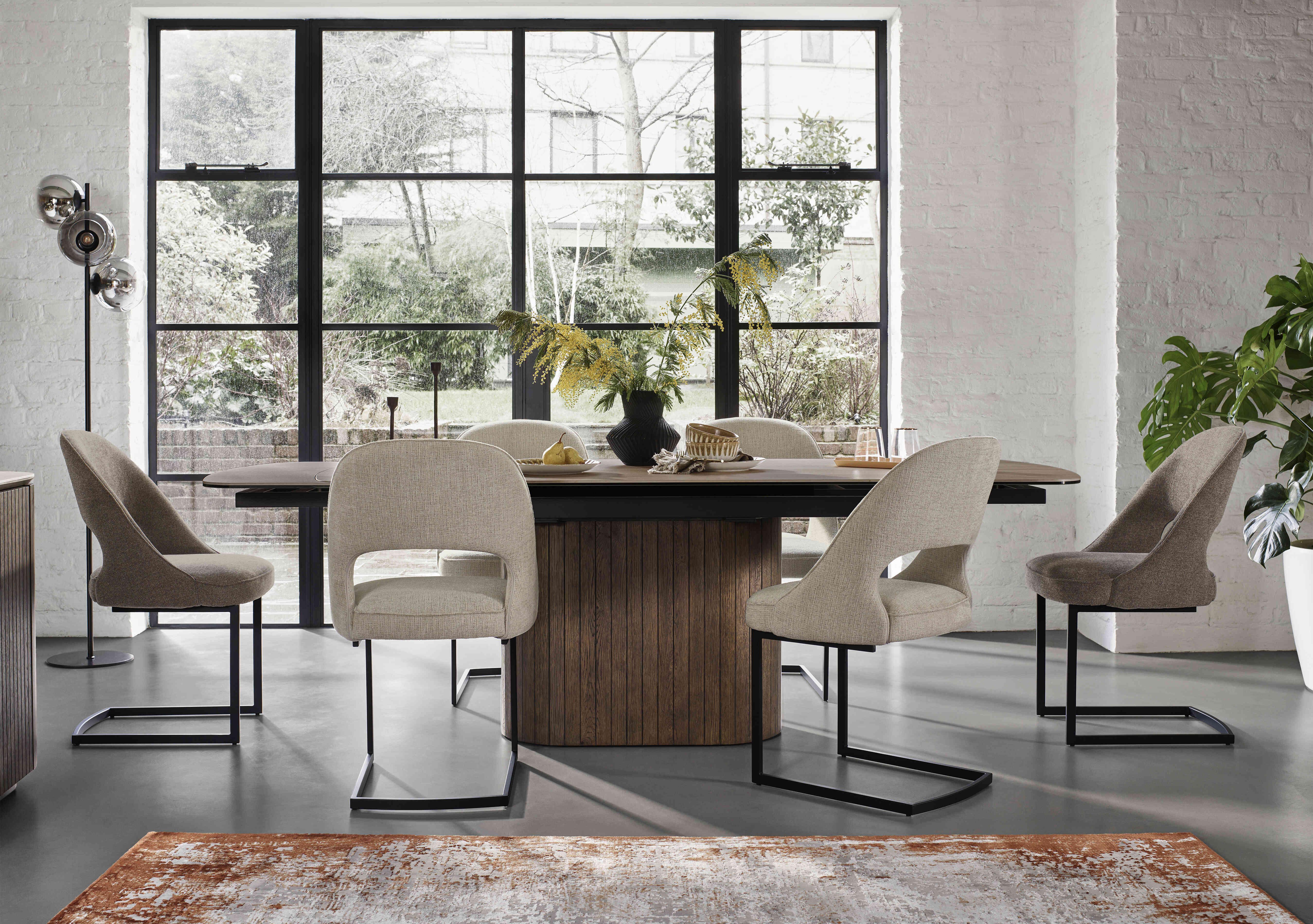 Tiber Large Draw Leaf Extending Dining Table with 4 Alabaster Cantilever Dining Chairs and 2 Truffle Cantilever Dining Chairs in  on Furniture Village